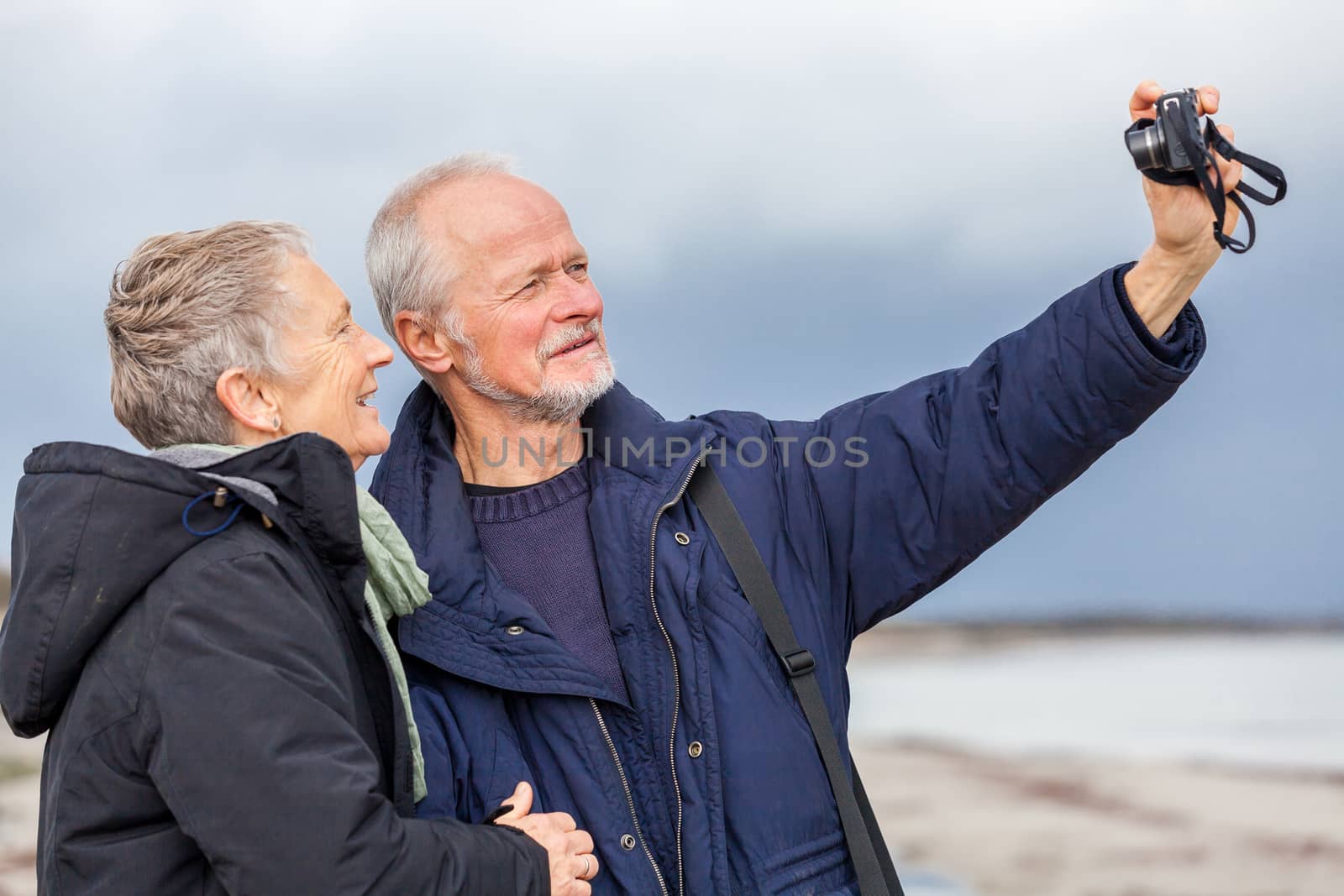 Elderly couple taking a self portrait by juniart