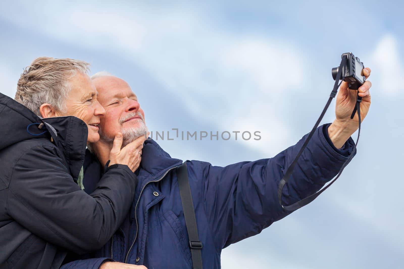 Elderly couple taking a self portrait by juniart
