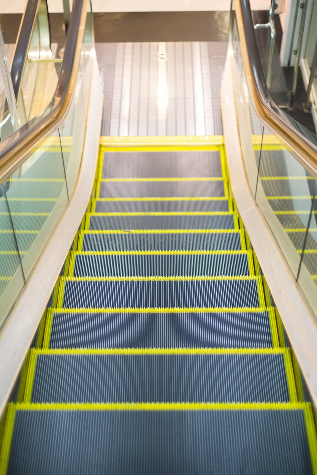 an escalator almost to the floor by iamway