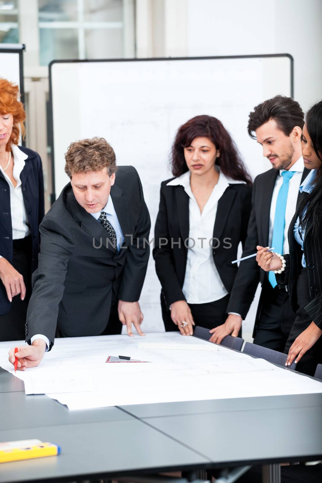 business people discussing architecture plan sketch in office