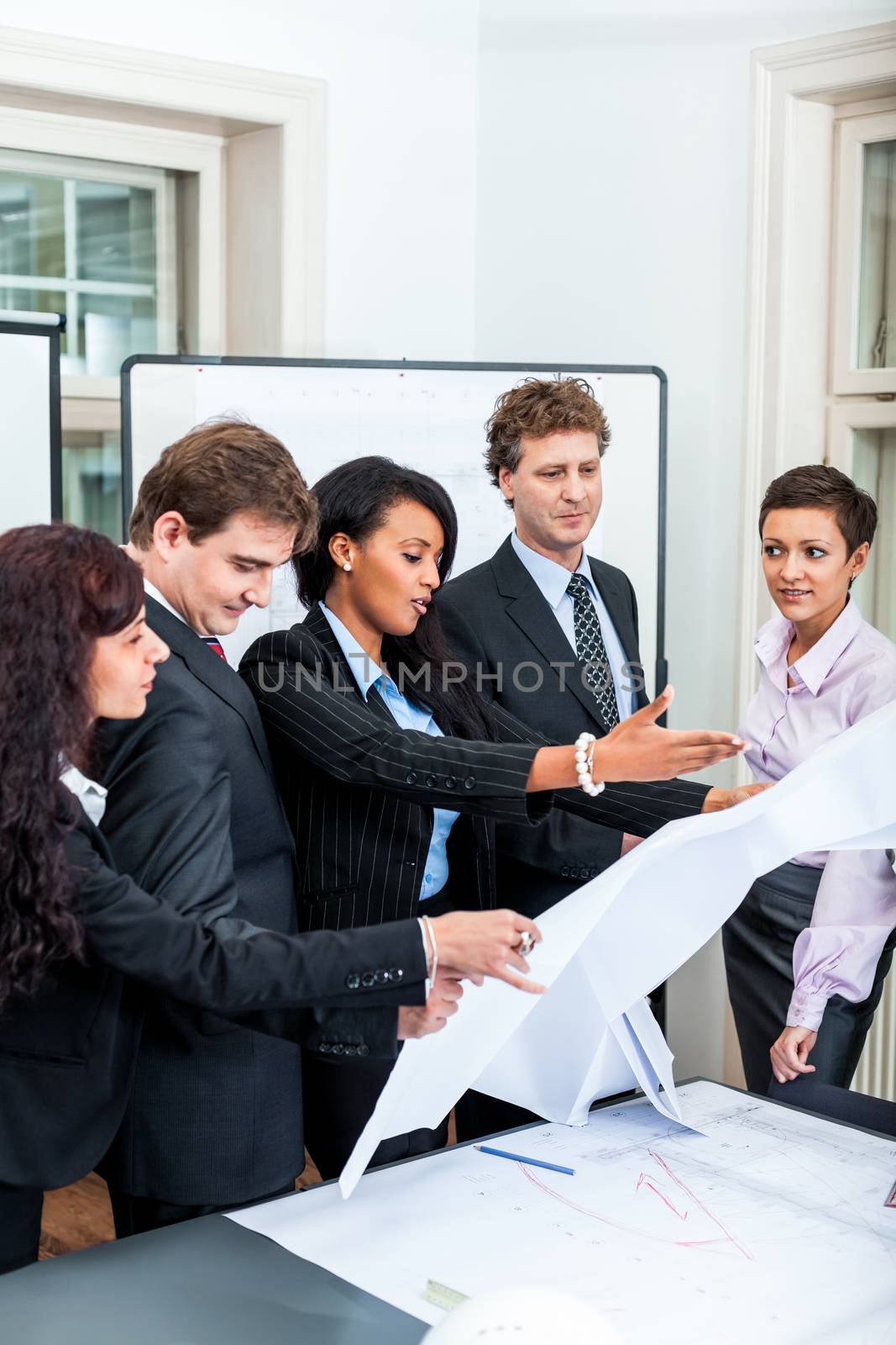 business people discussing architecture plan sketch in office