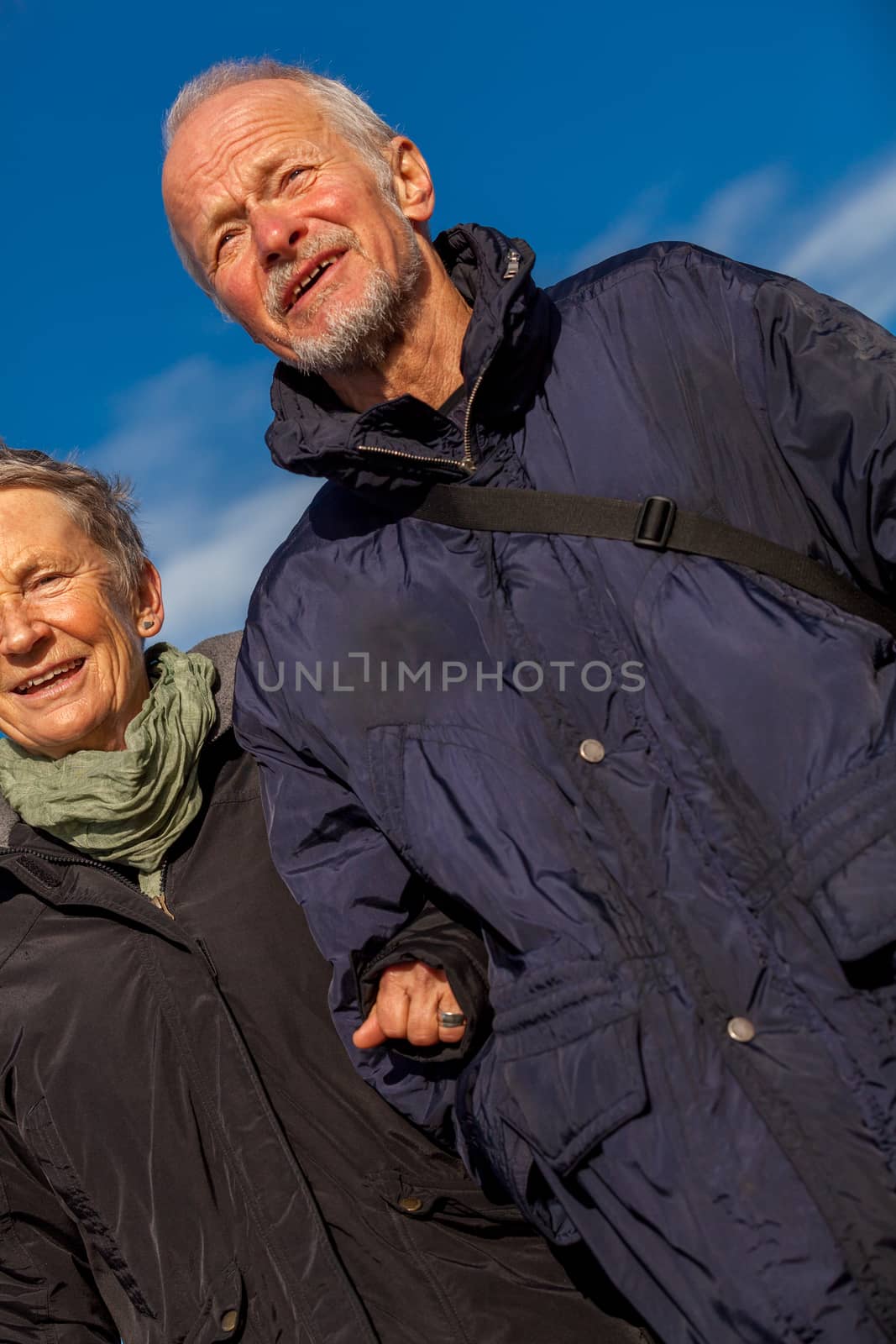 happy mature couple relaxing baltic sea dunes in autumn
