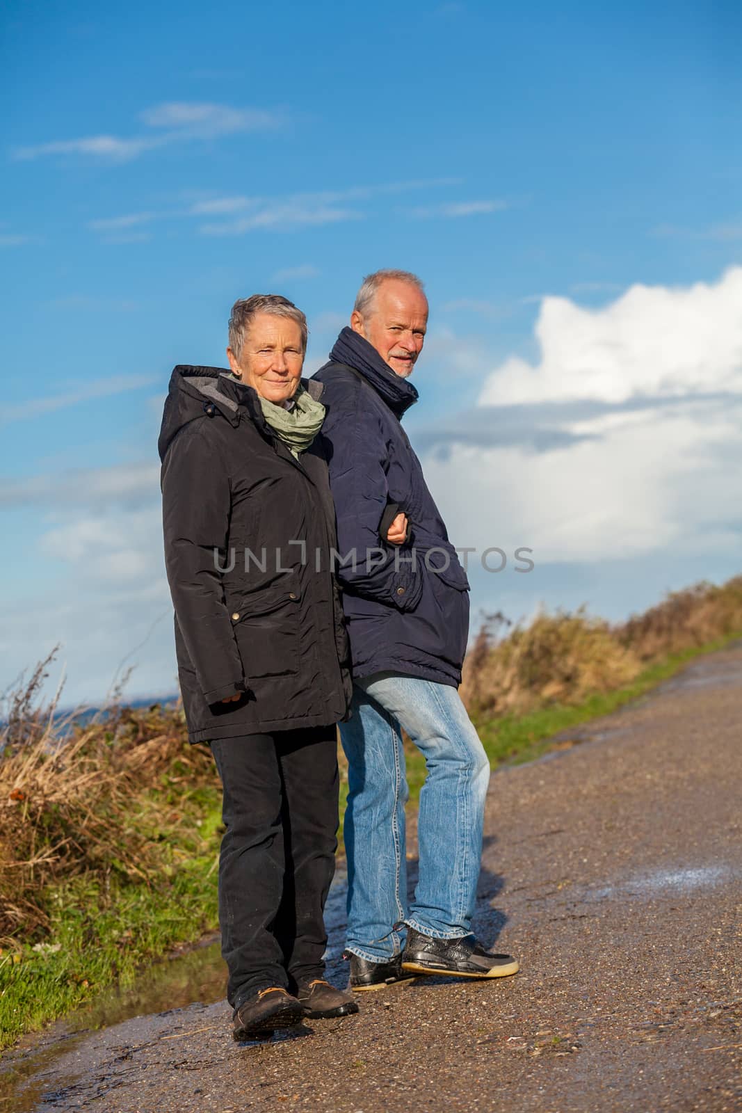 happy elderly senior couple walking on beach healthcare recreation