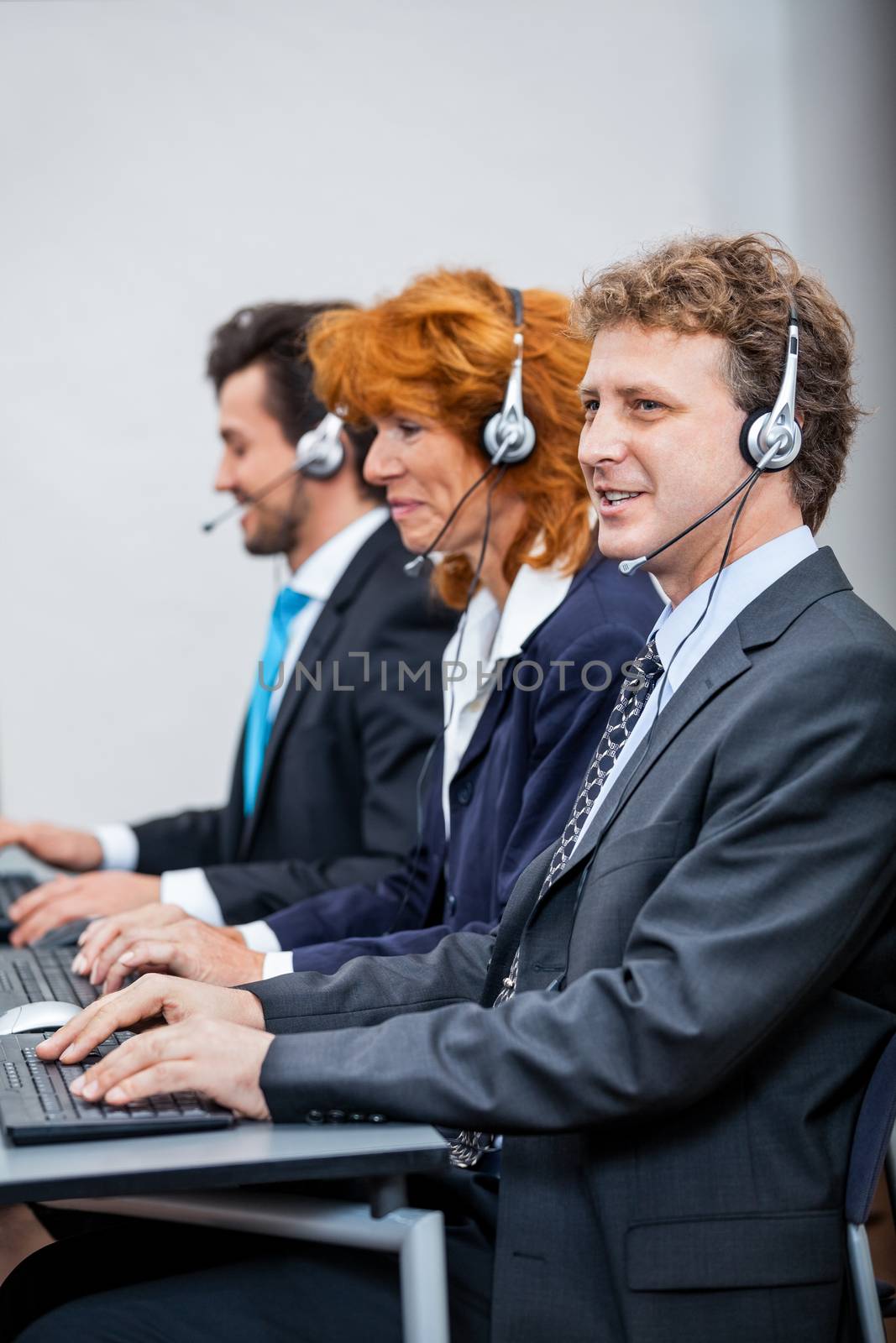 friendly callcenter agent operator with headset telephone  by juniart