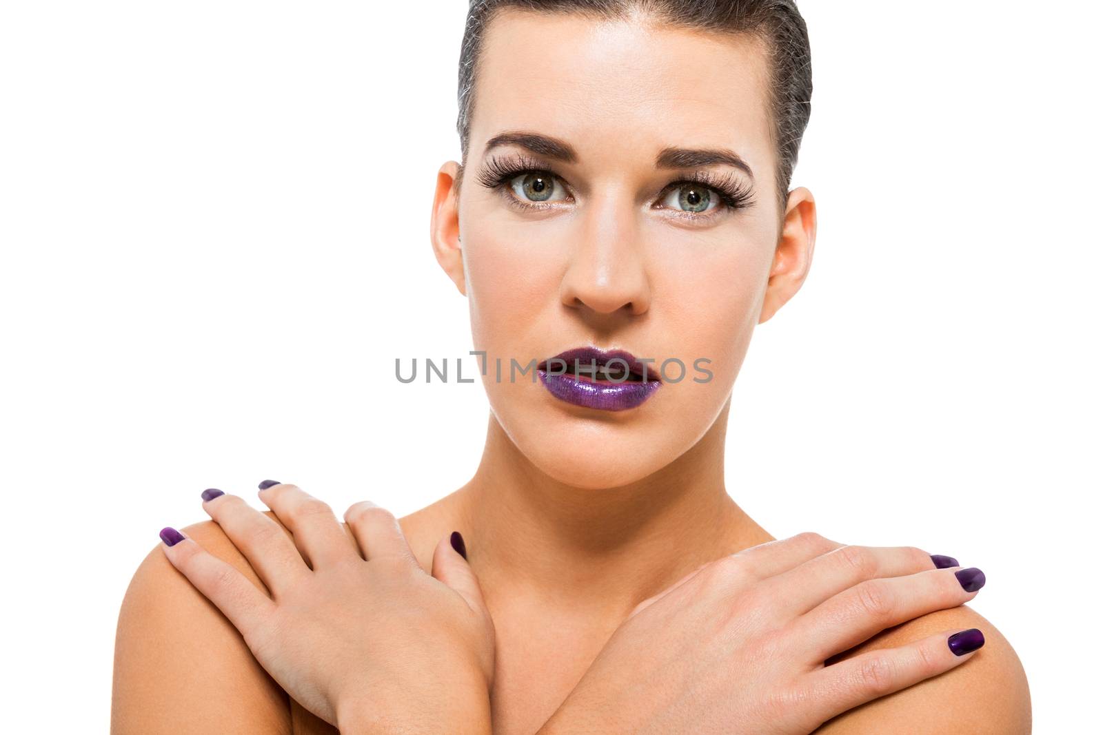 Graceful attractive woman with purple lips and nails portrait isolated