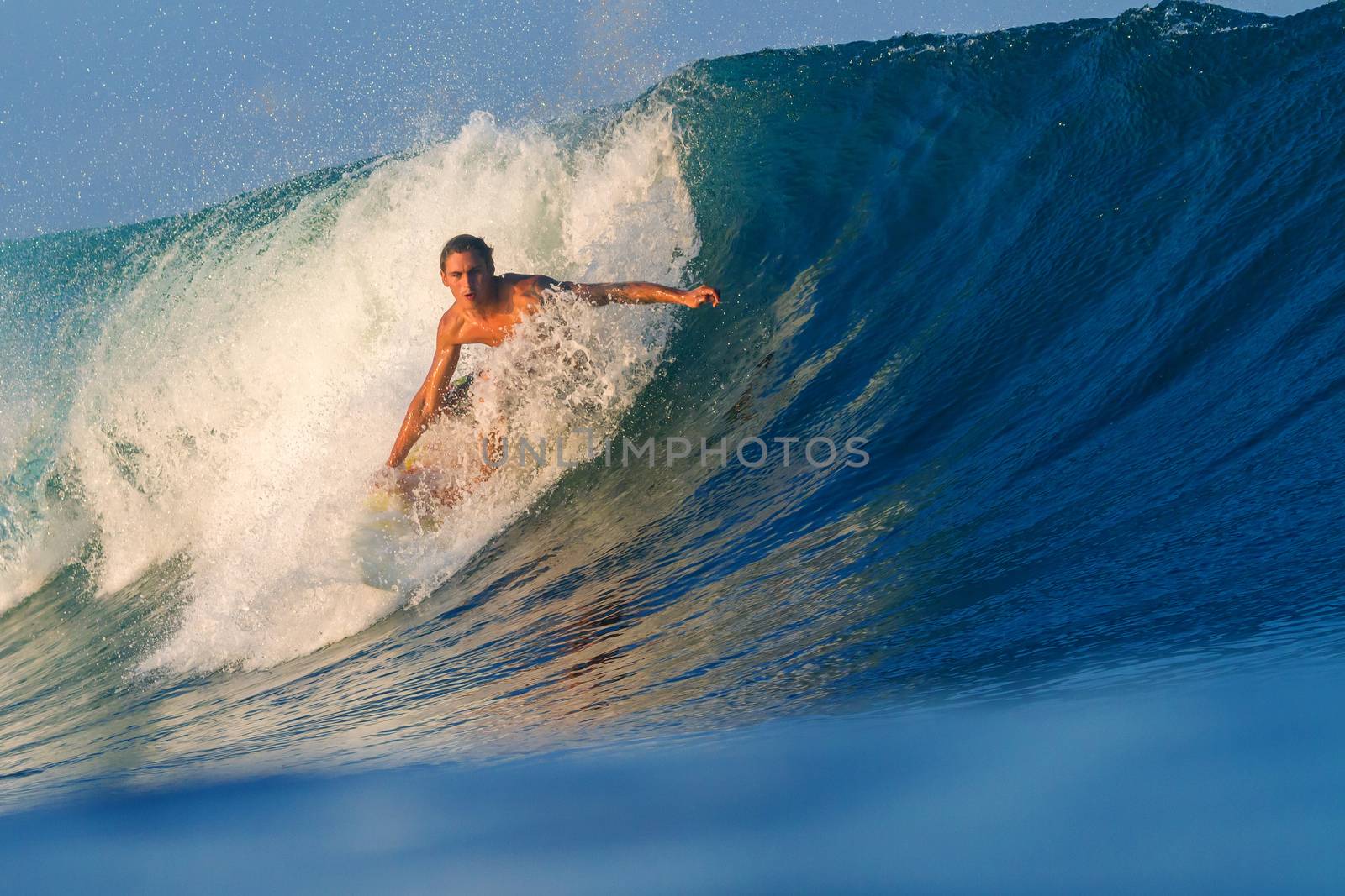 Picture of Surfing a Wave.Sumbawa Island. Indonesia.