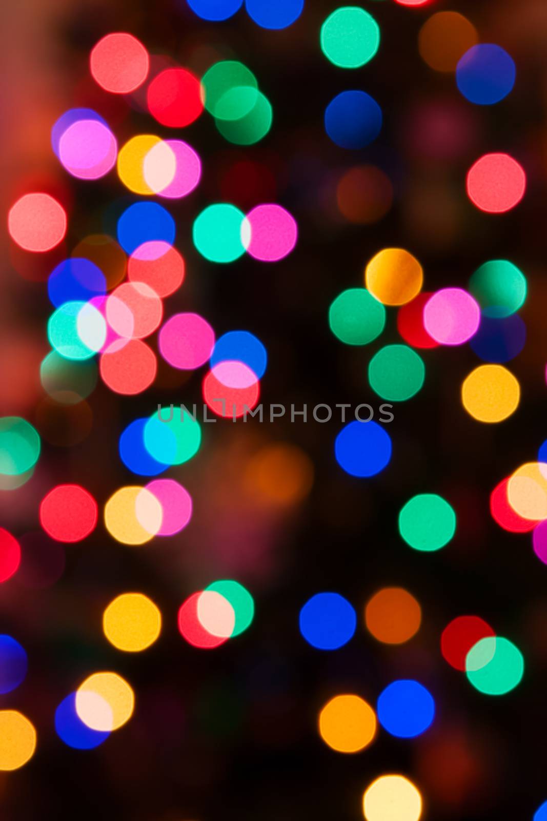 Glowing Christmas lights background in soft focus by Coffee999