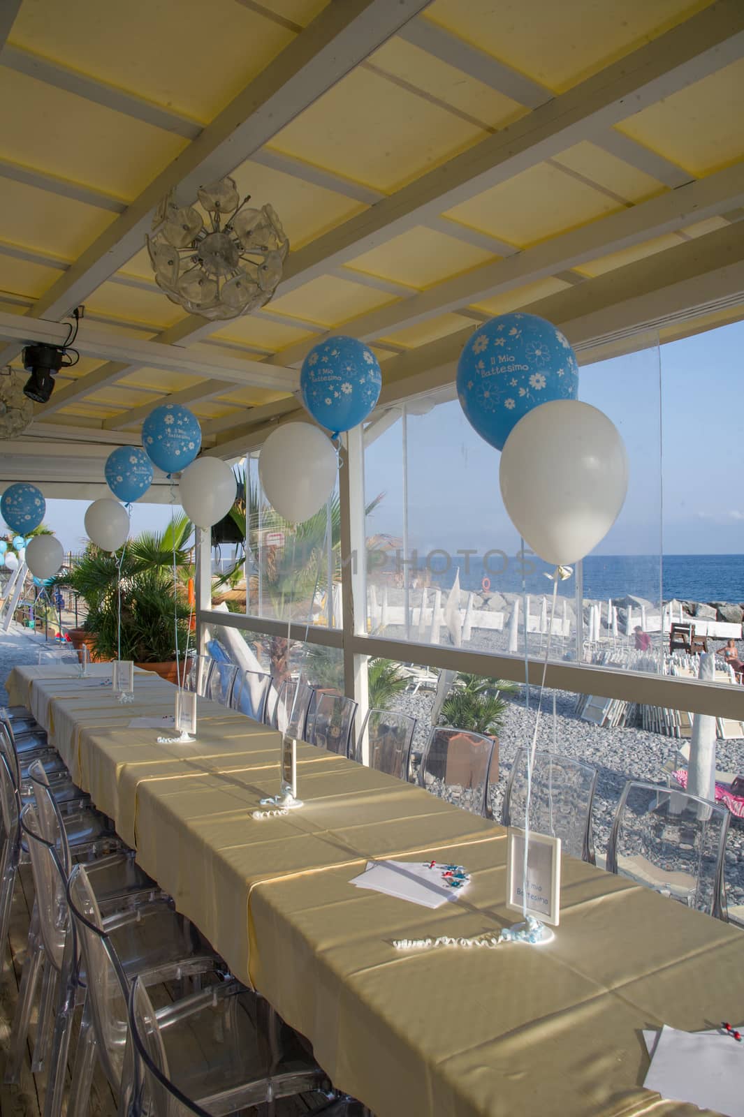 tables ready for christening party balloons with blue and white