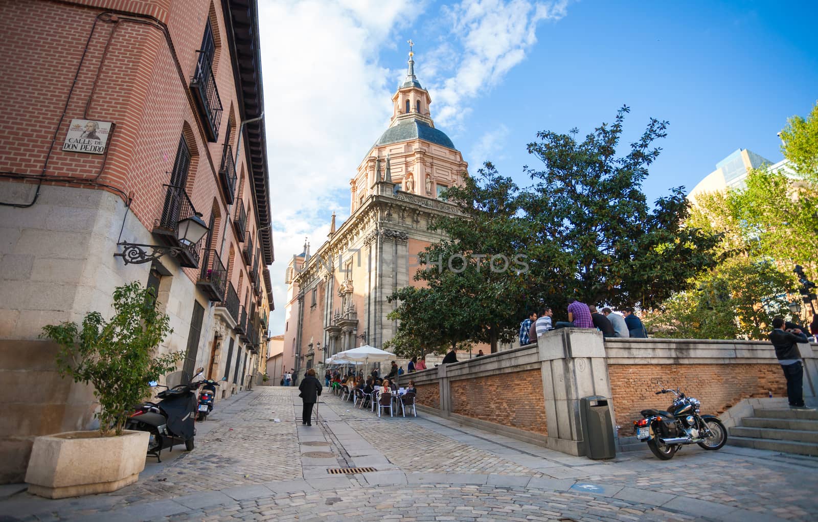Madrid, Spain - May 6, 2012: San Andres Church on a sunny spring day with tourists and local people in frot in Madrid, Spain