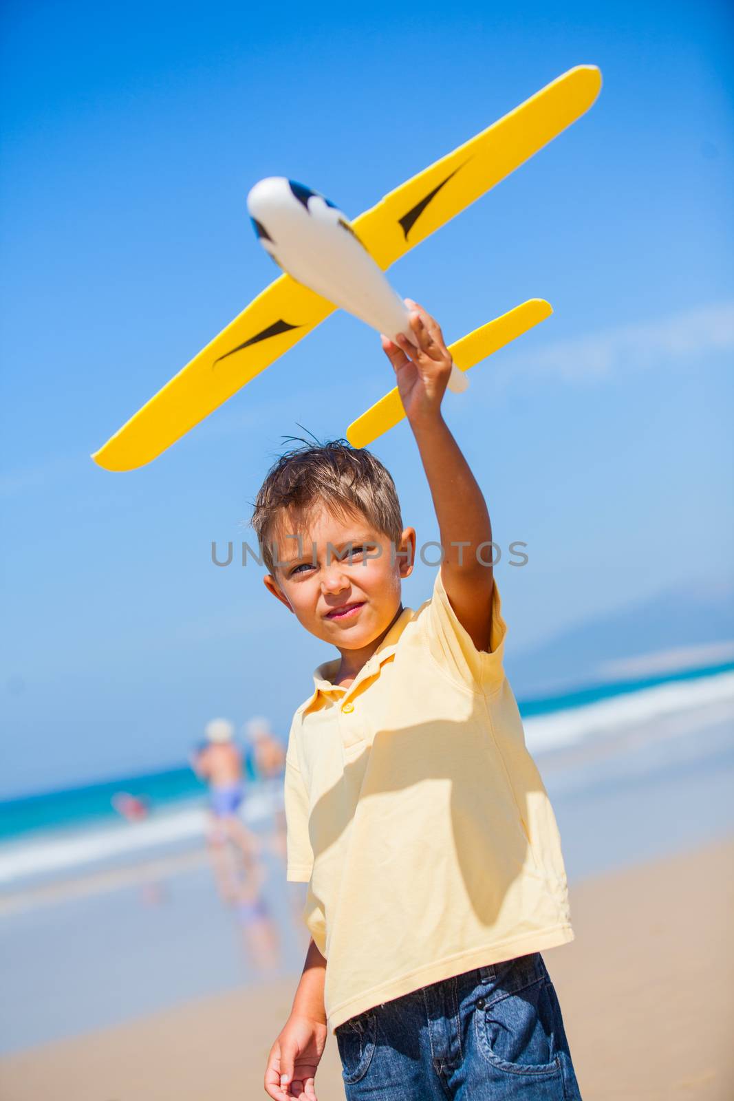 Beach kid boy kite flying outdoor coast ocean