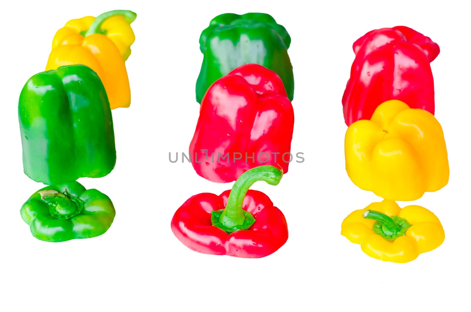 Yellow, Red, Green pepper sliced isolated against white background.