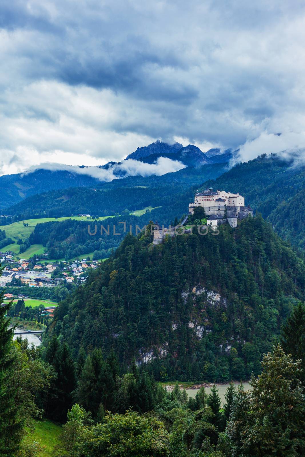 Castle Hohenwerfen by Salzburg on a misty mountain in the Alps