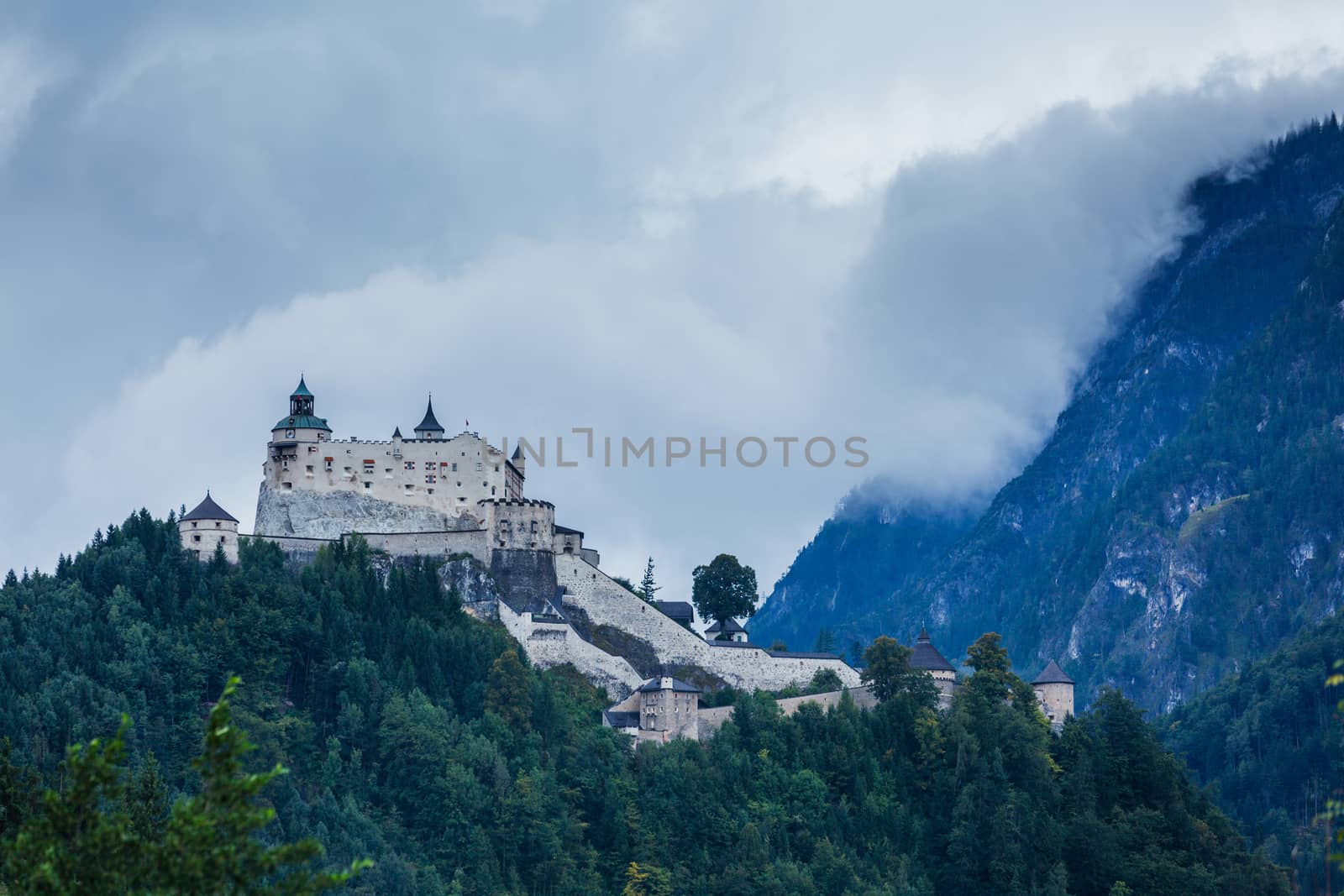 Castle Hohenwerfen by Salzburg on a misty mountain in the Alps