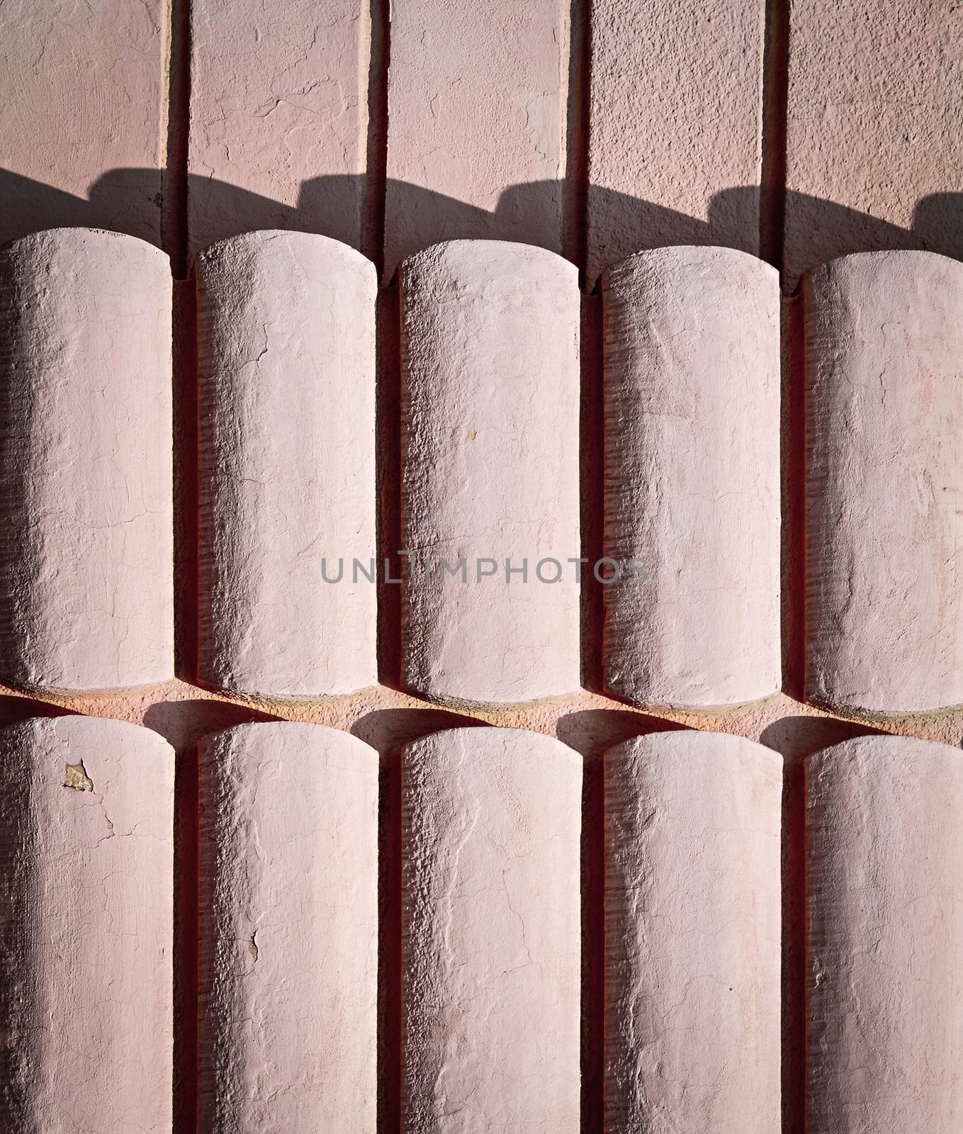 background or texture old pink wall with relief in the shade