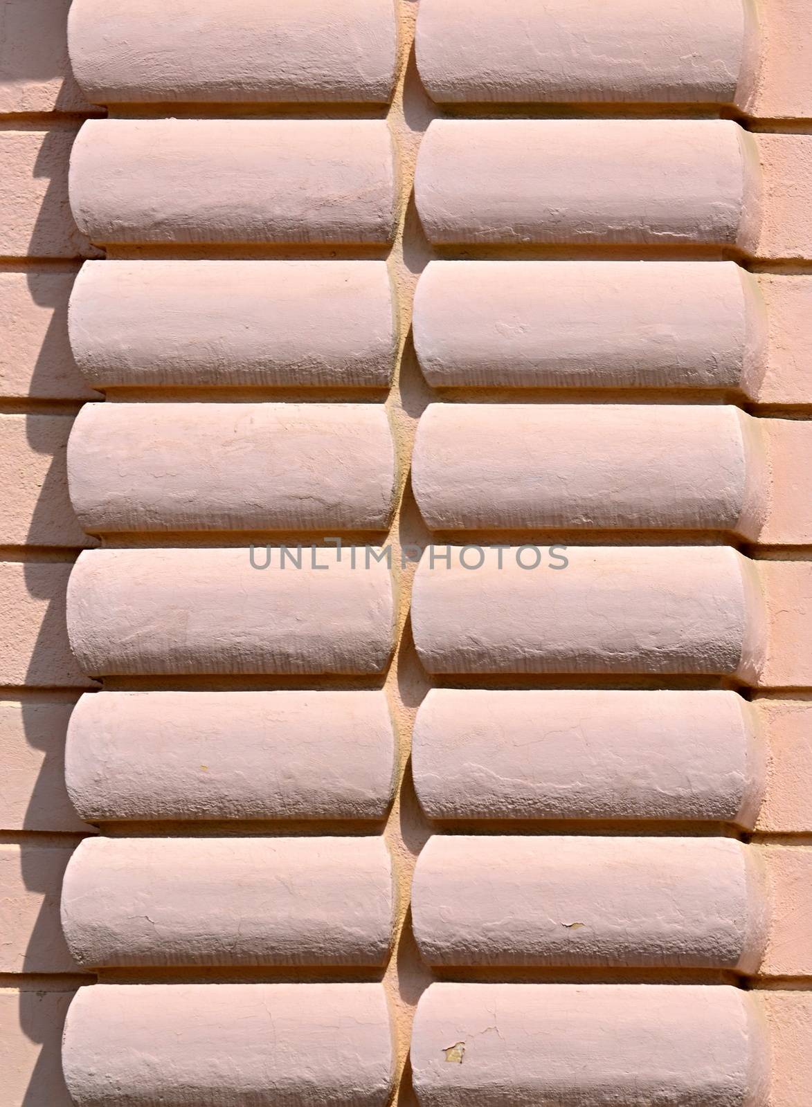 background or texture old pink wall with relief in the shade