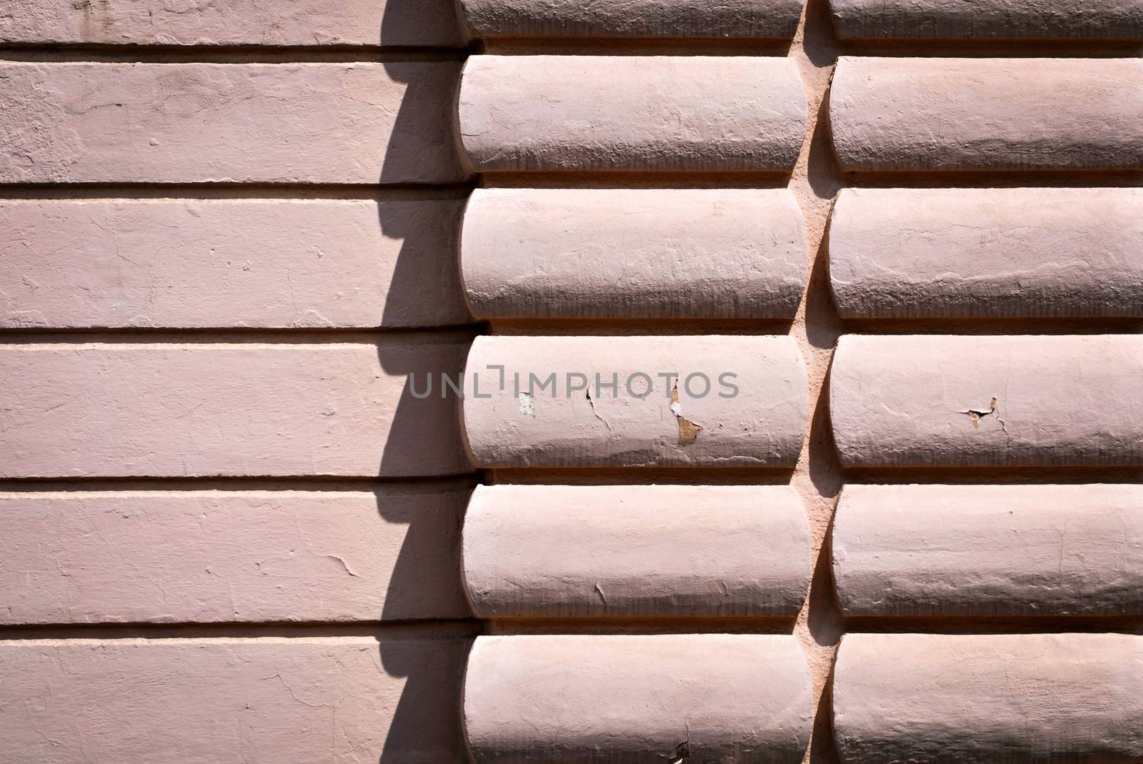 background or texture old pink wall with relief in the shade