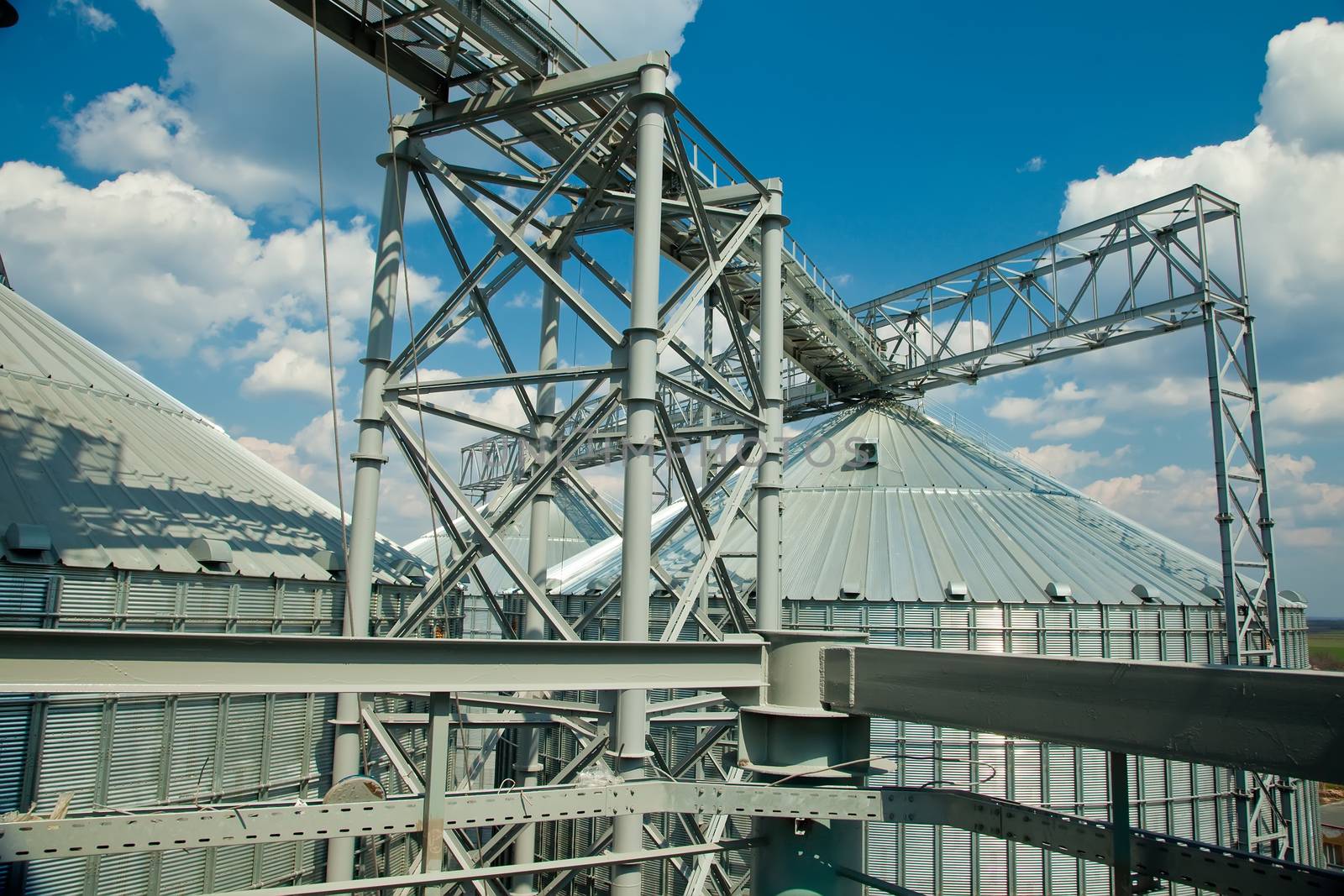 Towers of grain drying enterprise. metal grain facility with silos