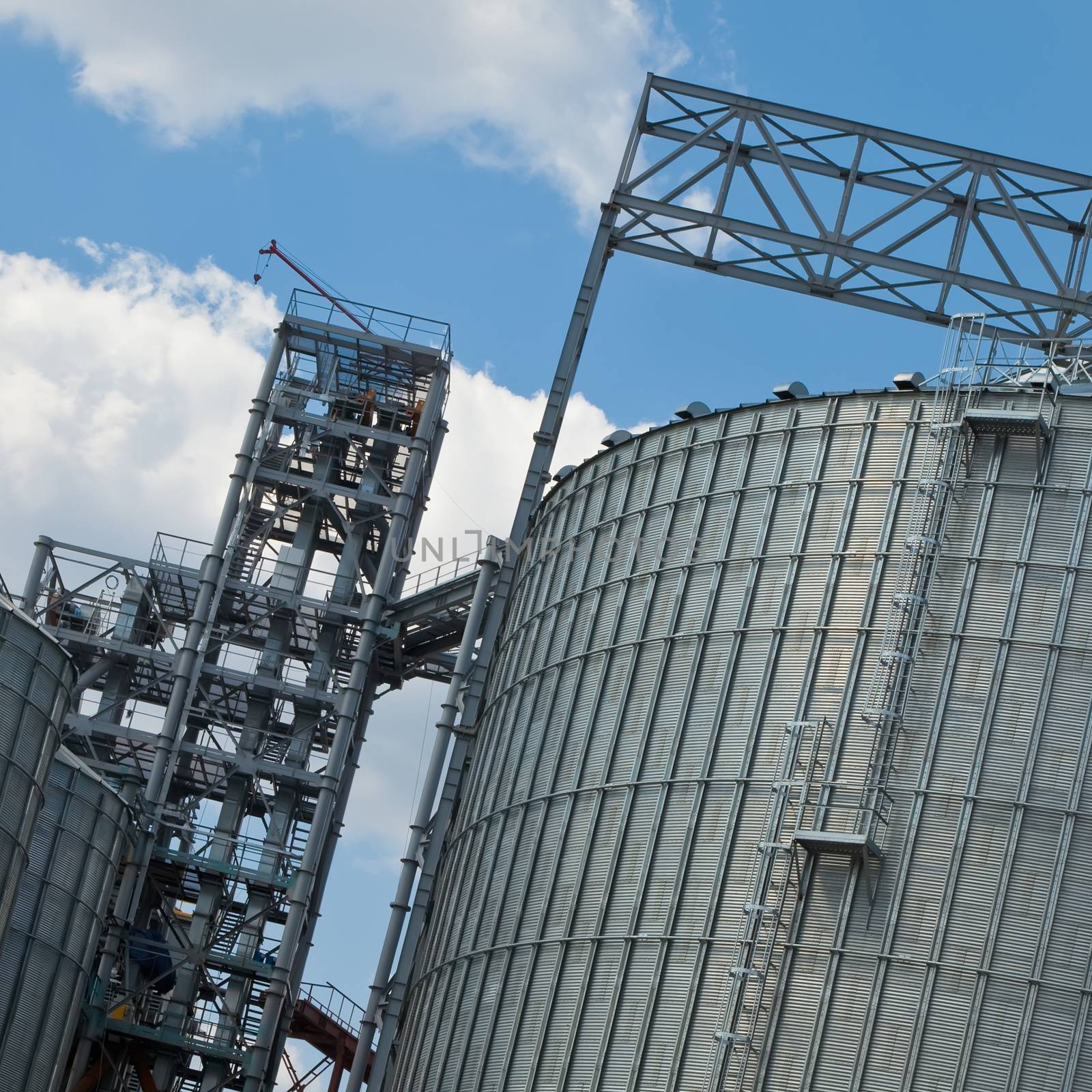 Towers of grain drying enterprise at sunny day by sarymsakov