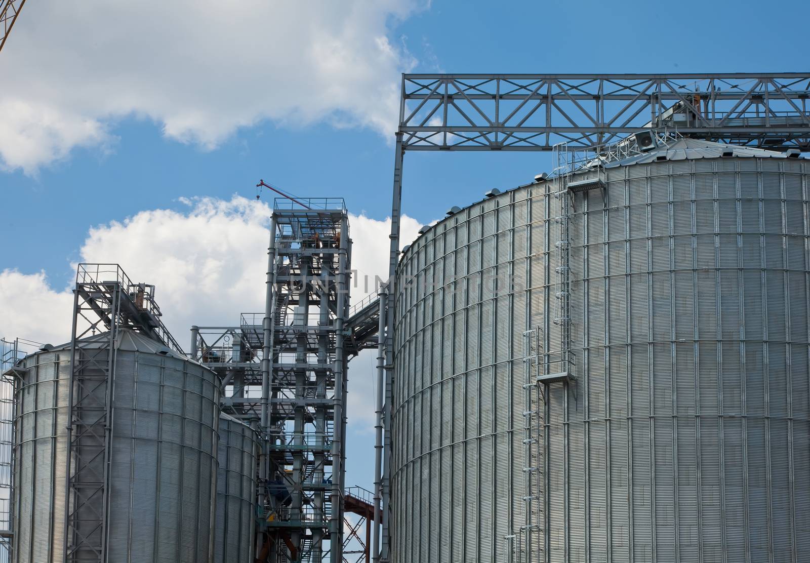 Towers of grain drying enterprise. metal grain facility with silos