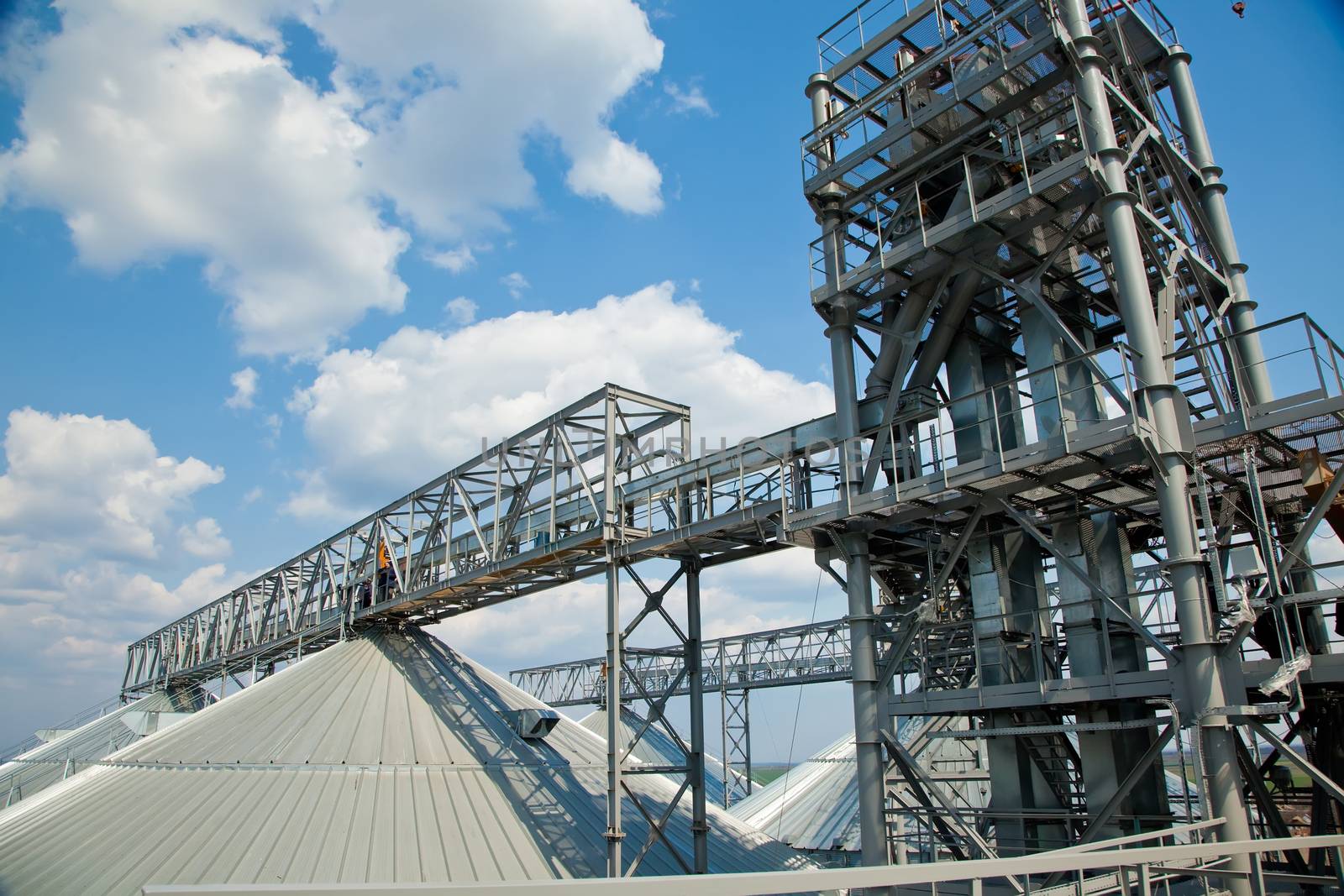 Towers of grain drying enterprise. metal grain facility with silos