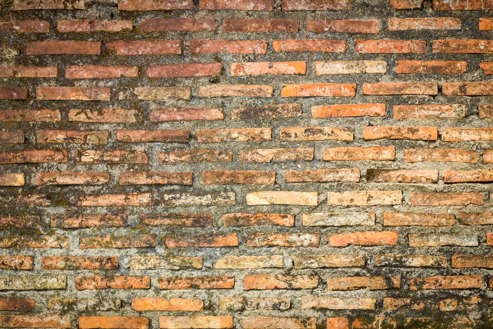 Old brick wall of a Buddhist temple - background.
