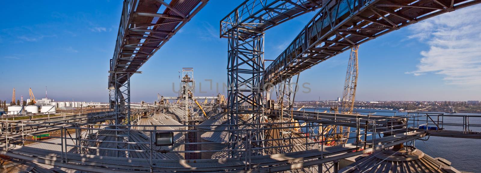 Towers of grain drying enterprise. metal grain facility with silos