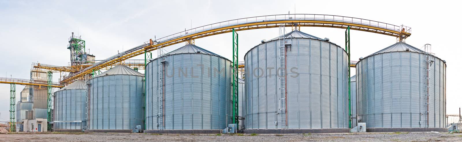 Towers of grain drying enterprise. metal grain facility with silos