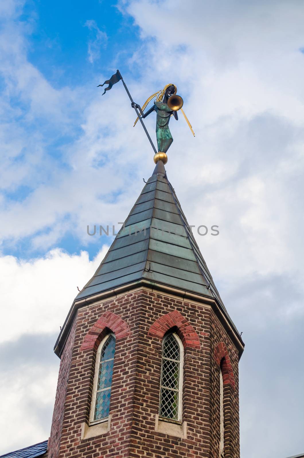 Church spire with figure by JFsPic