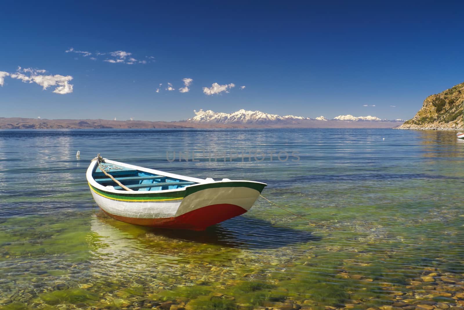 Small boat on the scenic coast of Isla del Sol, island on lake Titicaca in Bolivia