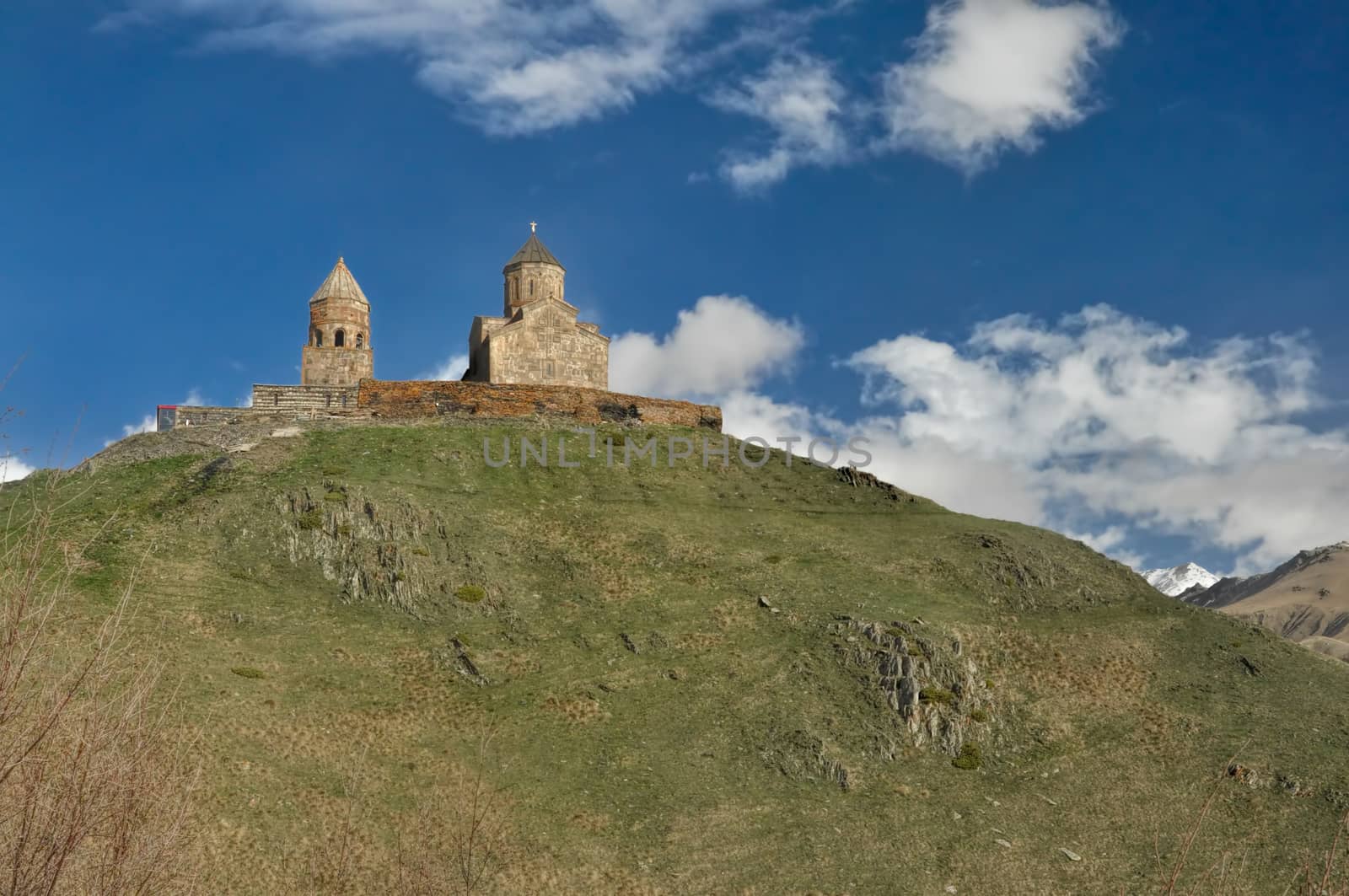 Scenic view of an old Georgian church standing on a hill in Georgia