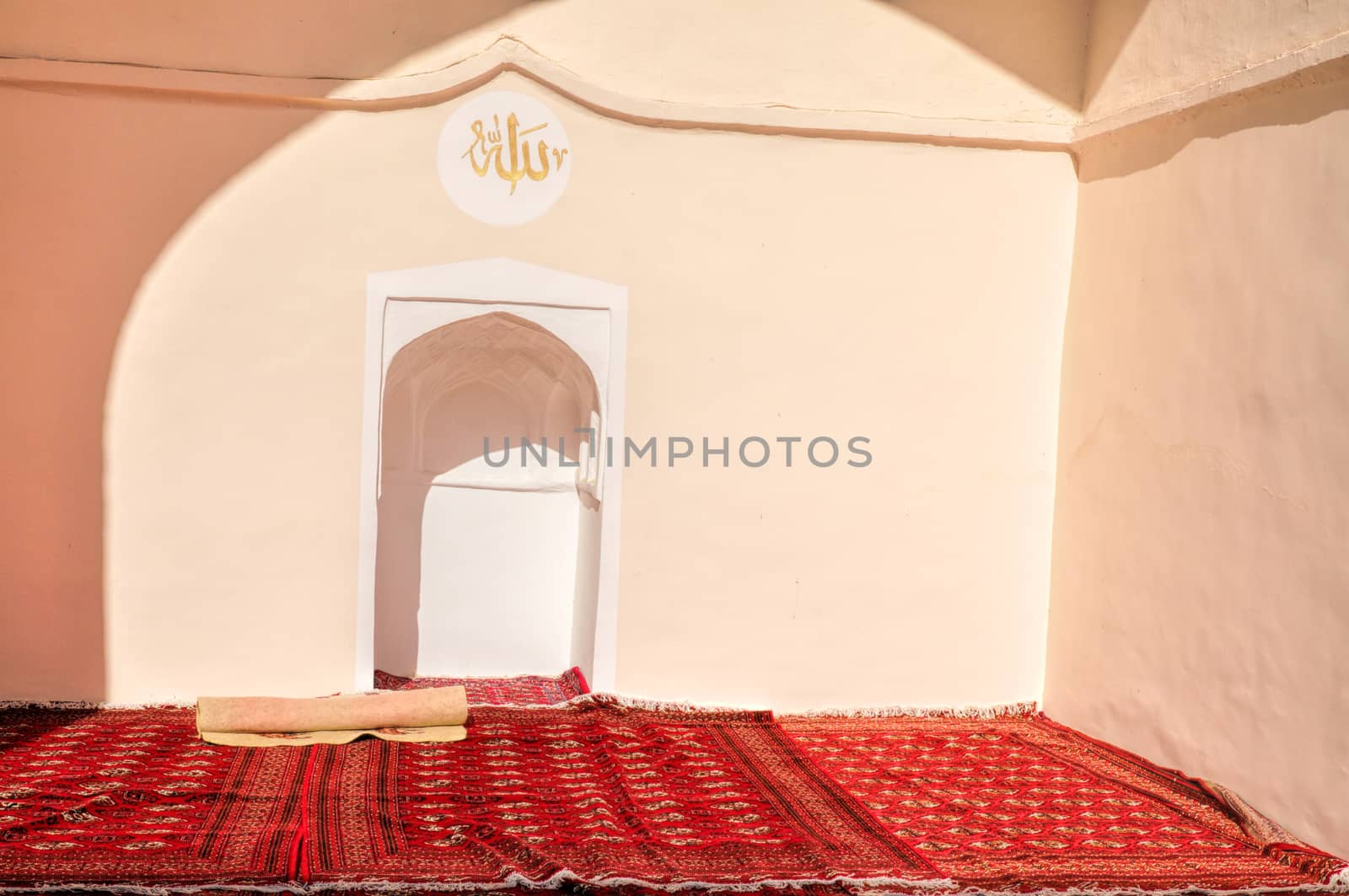 Islamic praying corner with red carpet in Merv, Turkmenistan