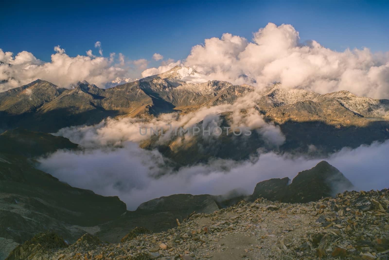 Majestic mountain peaks in clouds in Bolivian Andes