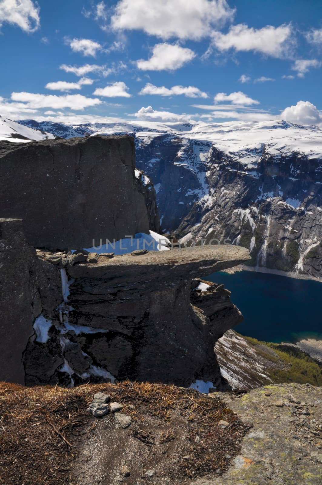 Side view of the whole Trolltunga rock sticking out of the mountain in Norway
