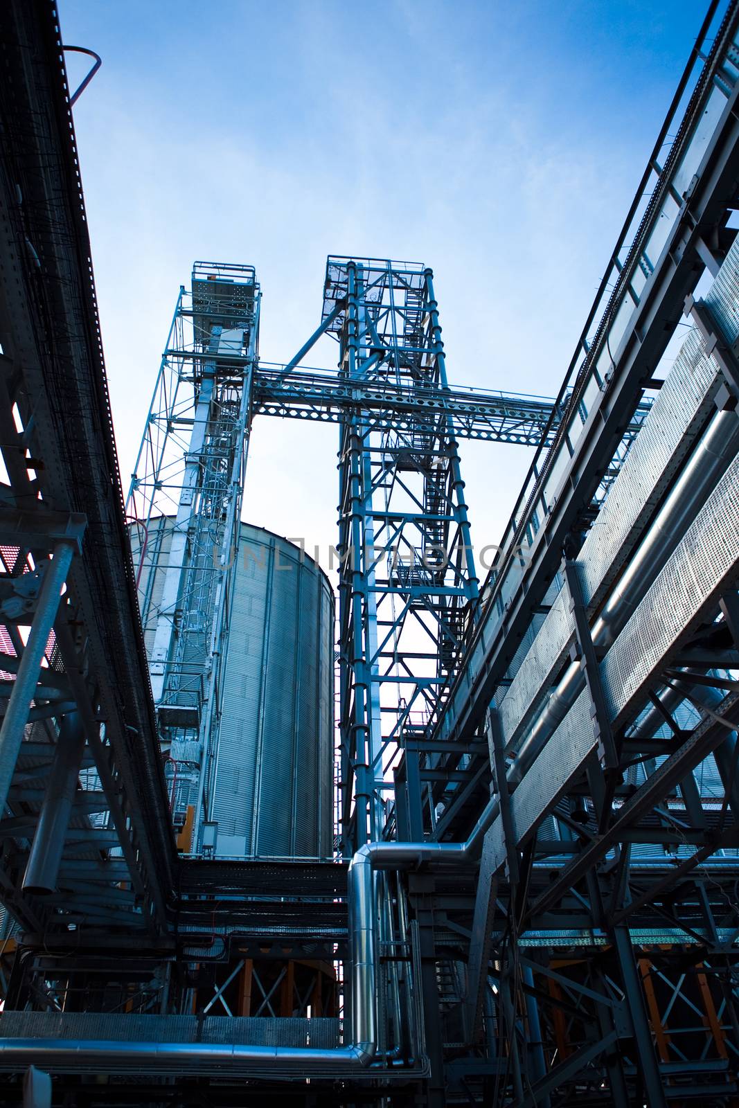 Towers of grain drying enterprise at sunny day by sarymsakov