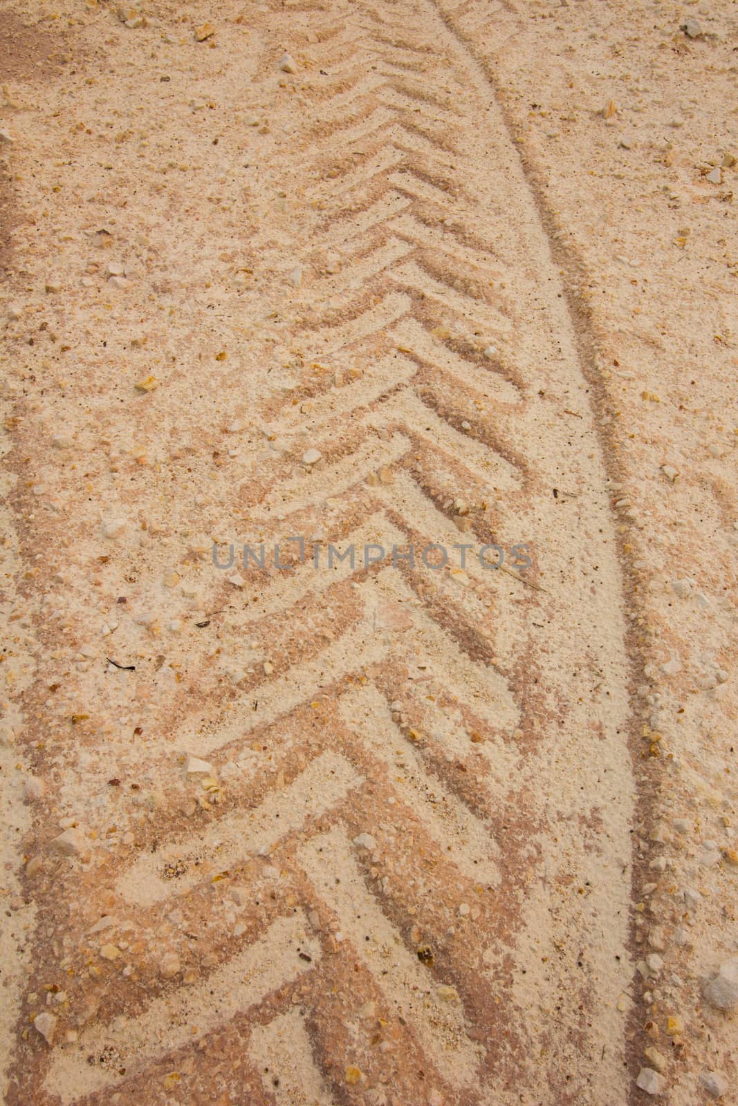 background of traces of truck and dumper in mud.