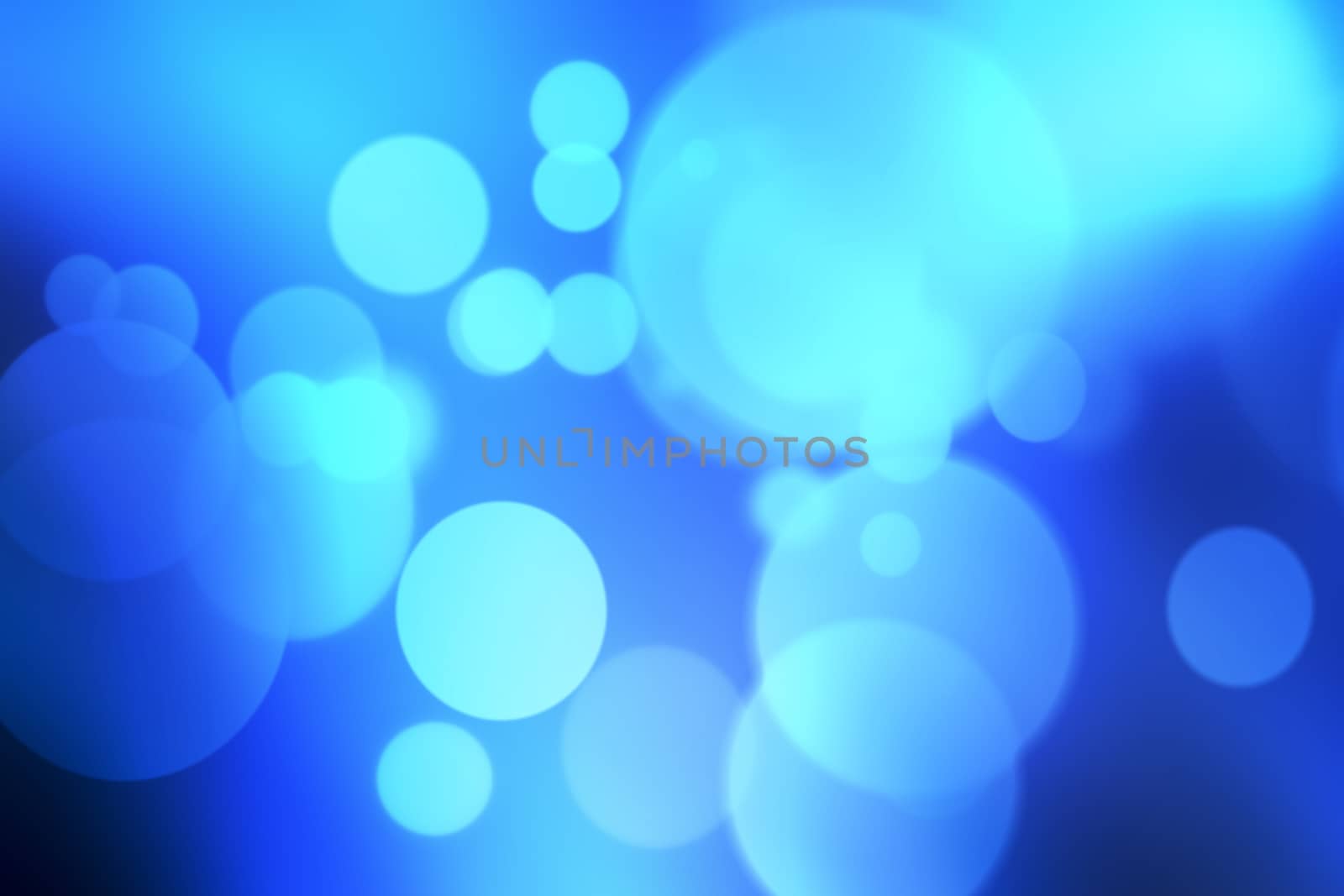 Blue bokeh abstract light background.