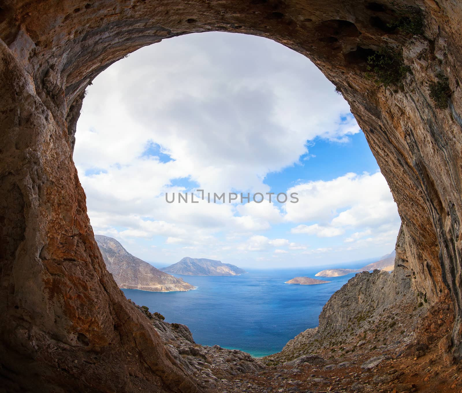 View of sea and islands from cave in mountain by photobac