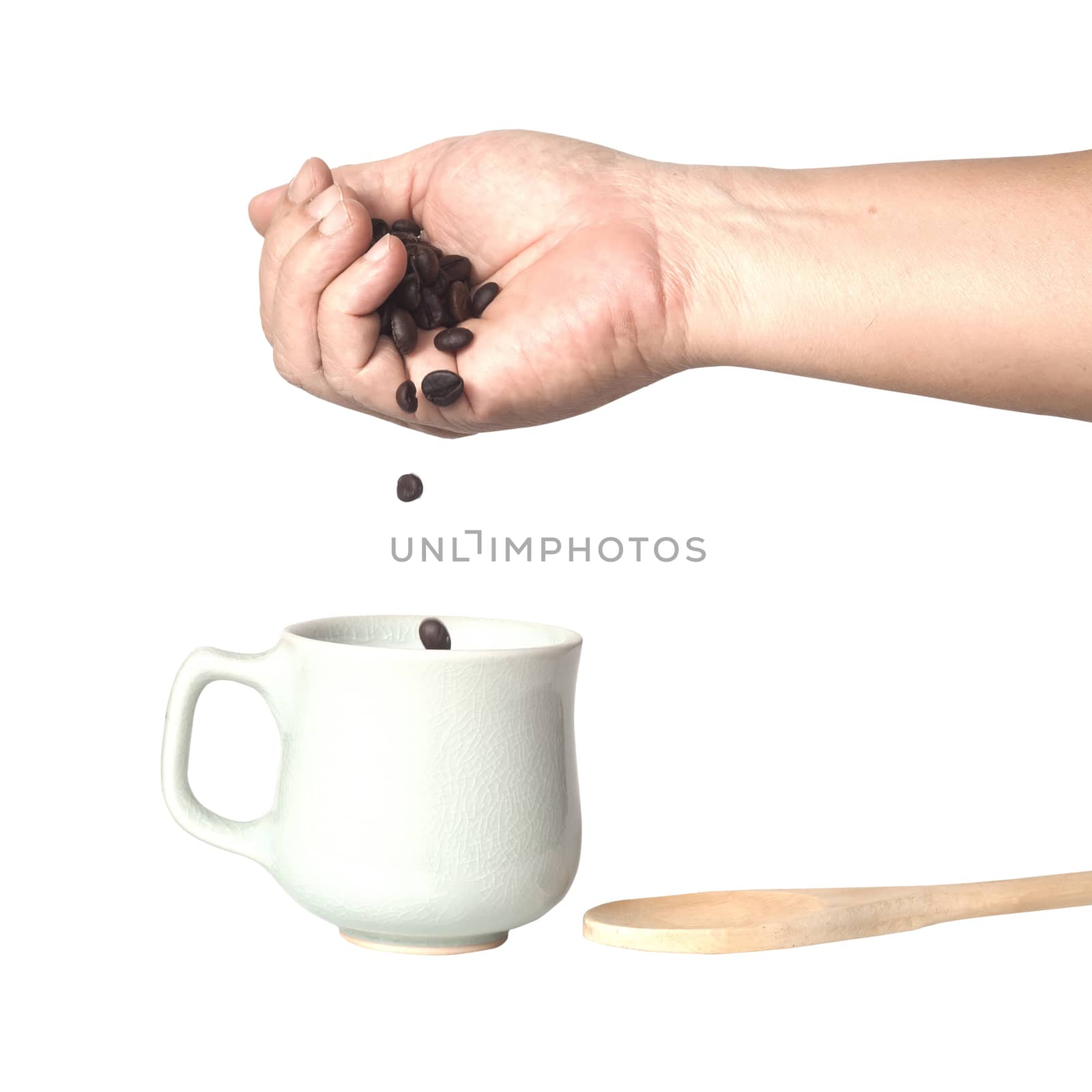 coffee beans in hands, isolated on white 