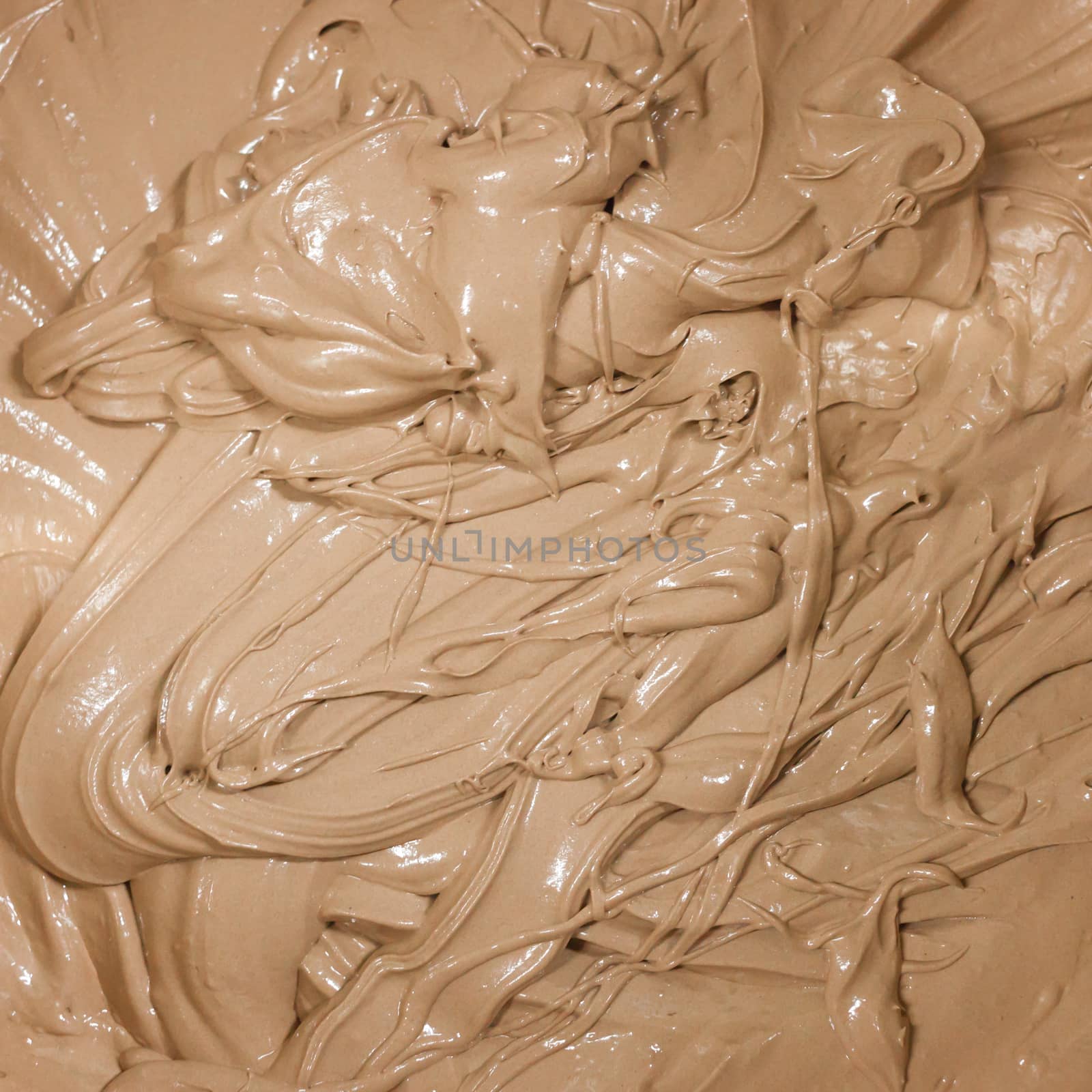 Macro image of a dark melted chocolate .