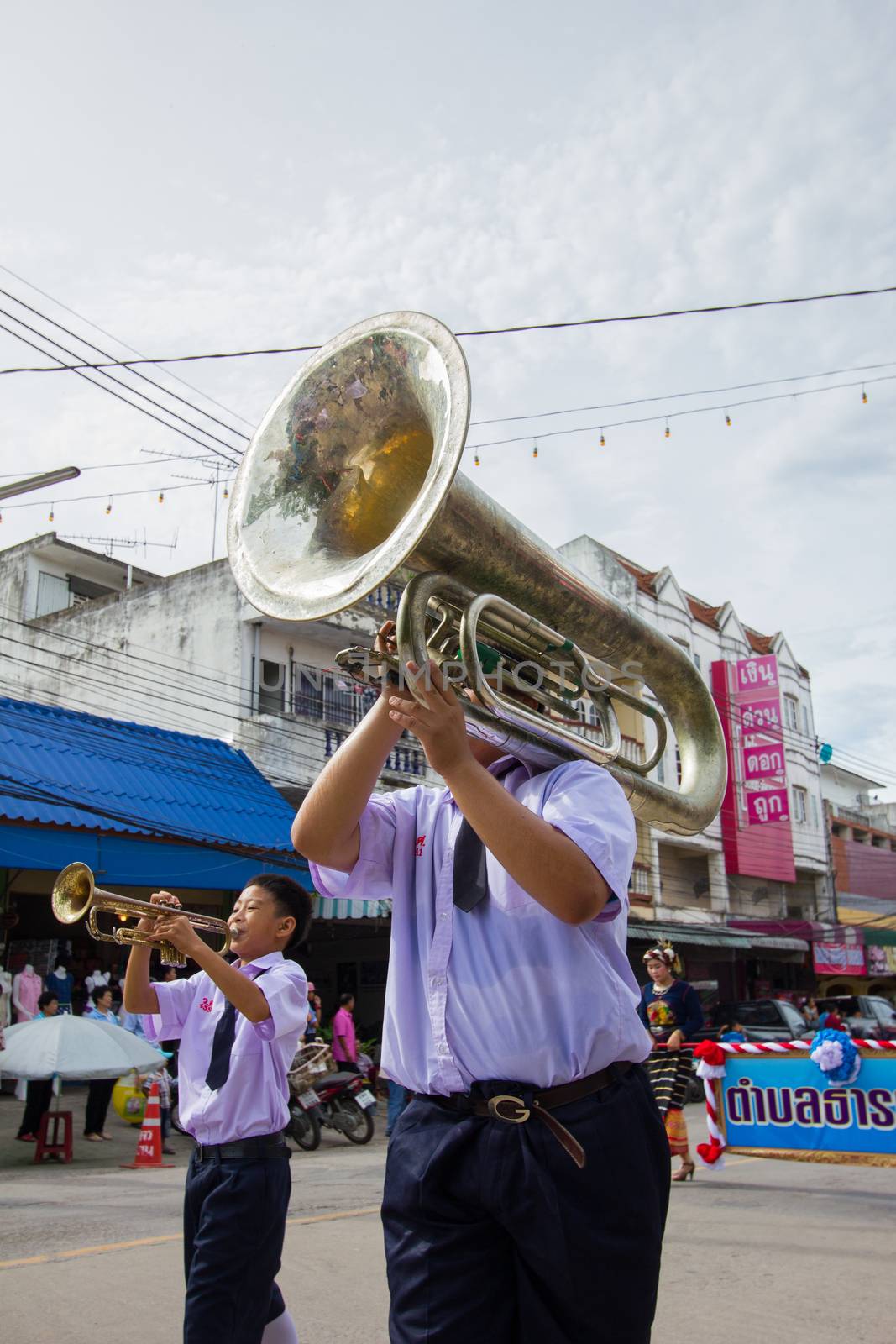 CHIANGRAI, THAILAND - AUG 12: unidentified young boy playing marching tuba on August 12, 2014 in Chiangrai, Thailand.