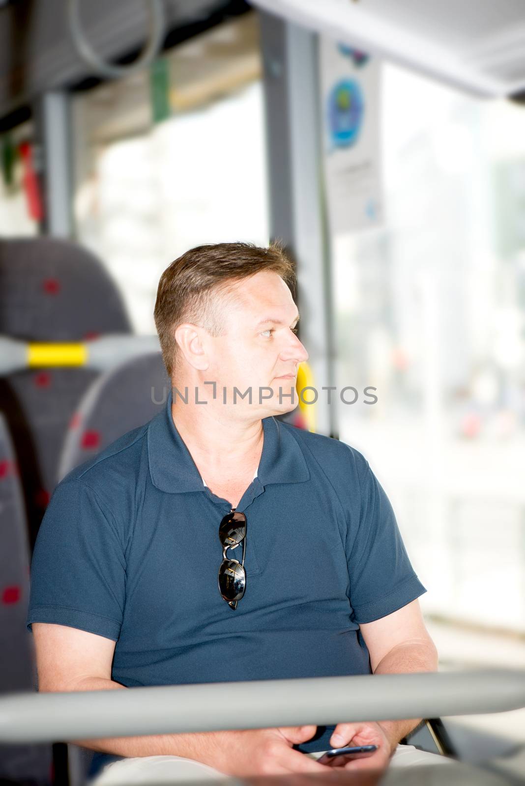 Man traveling on bus by Nanisimova