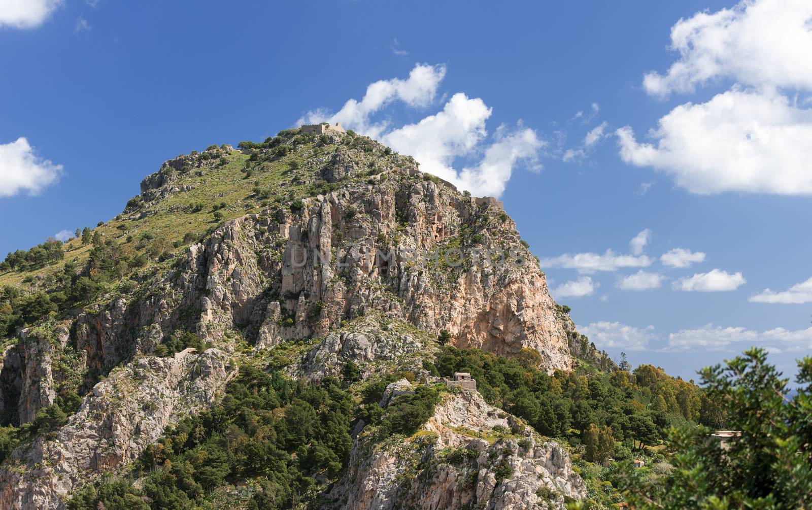 Mountain with ancient ruins at Cefalu by Nanisimova