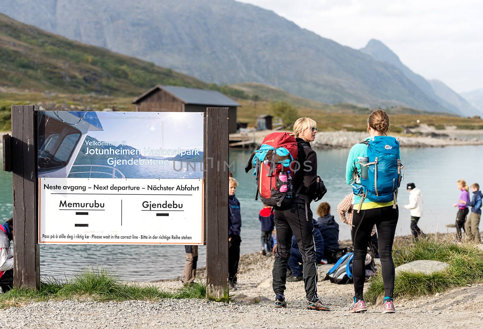 BESSEGGEN, NORWAY - AUGUST 6: Hikers waiting for ferry. Besseggen is one of the most popular mountain hikes in Norway. About 30,000 people walk this trip each year.