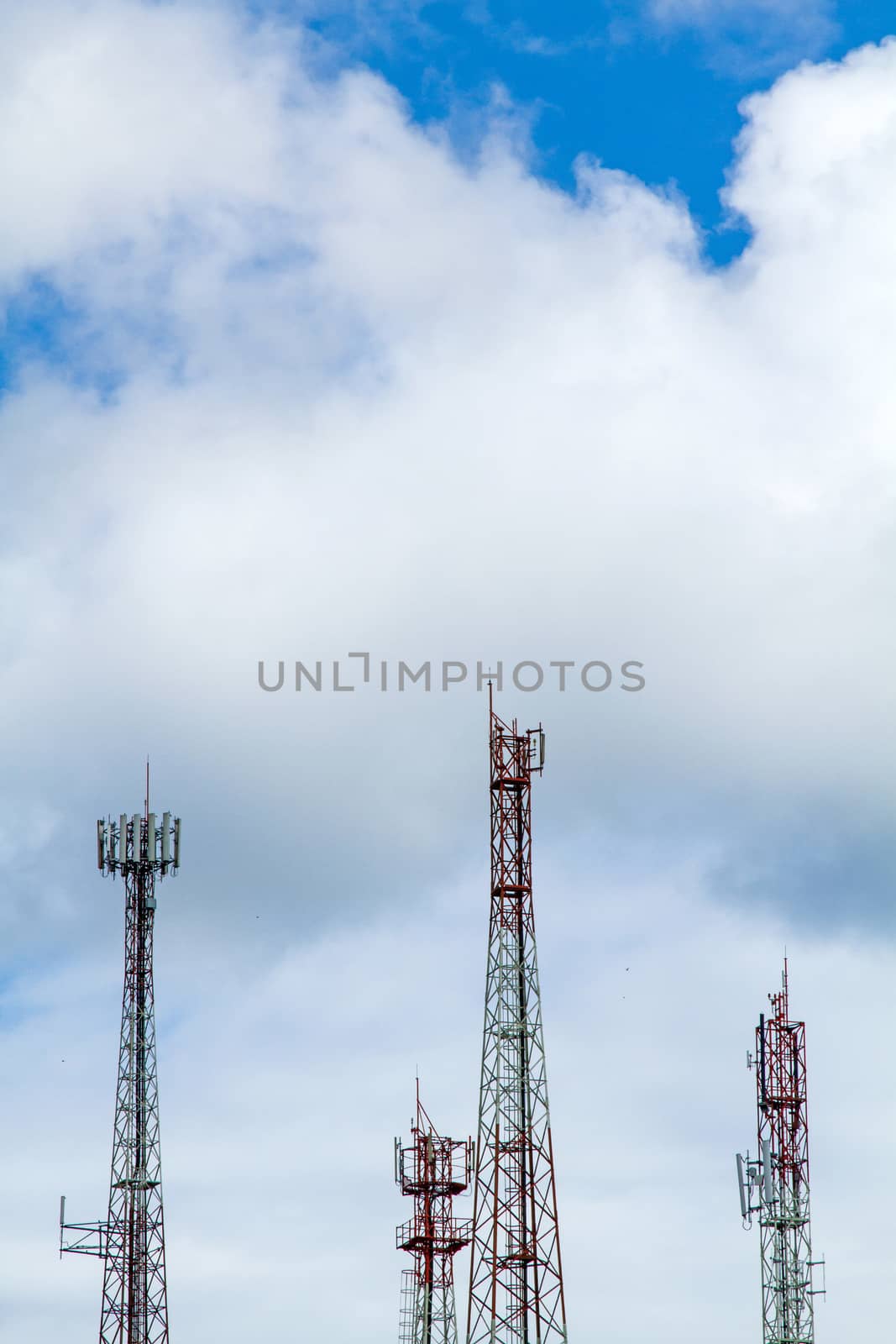 Communication tower over a blue sky background