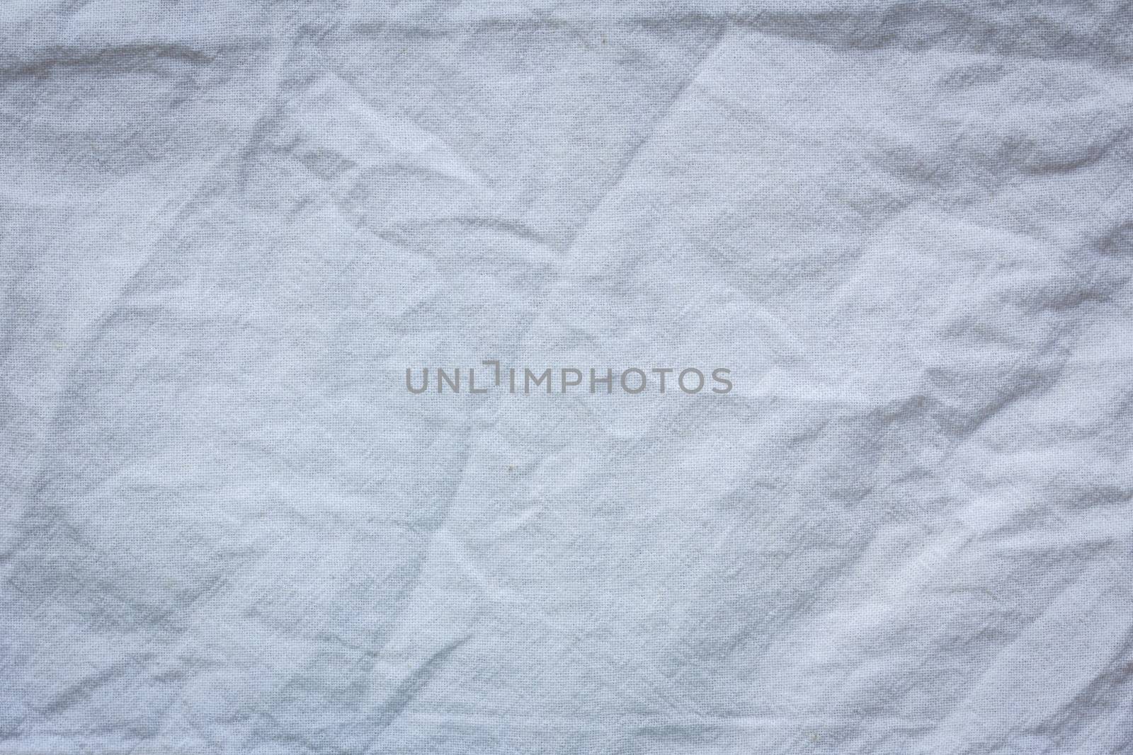 white crumpled cloth textile texture background.