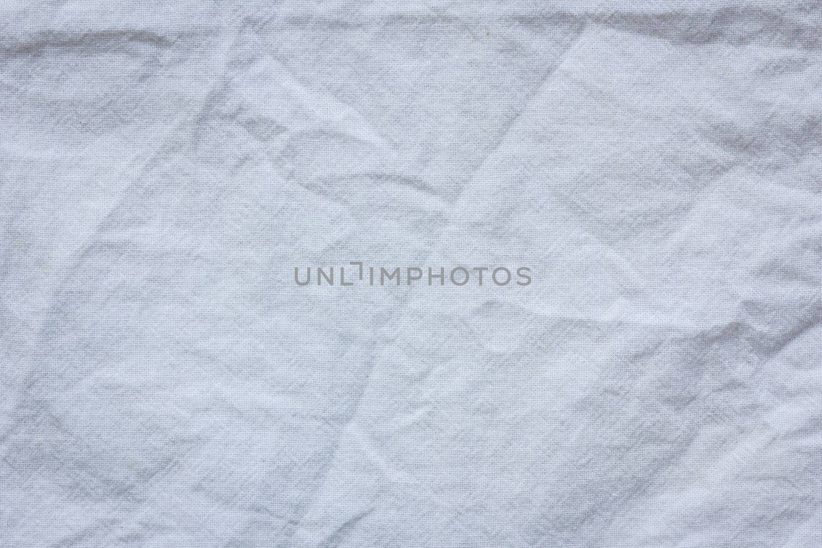 white crumpled cloth textile texture background.