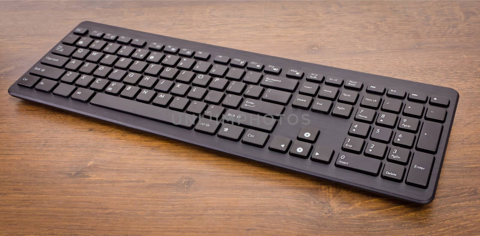 keyboard with black buttons and white letters