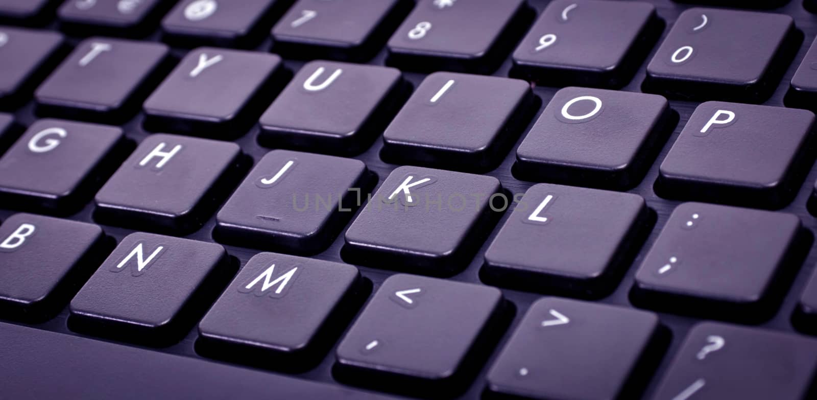 keyboard with black buttons and white letters