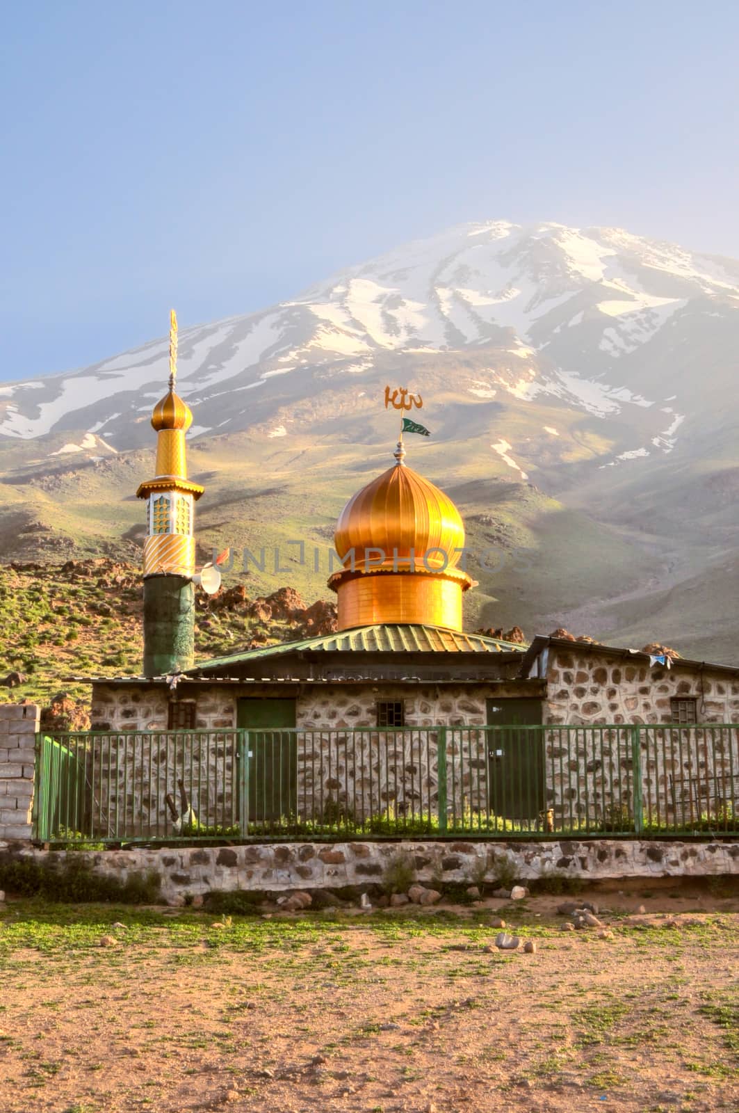 Mosque underneath volcano Damavand, highest peak in Iran