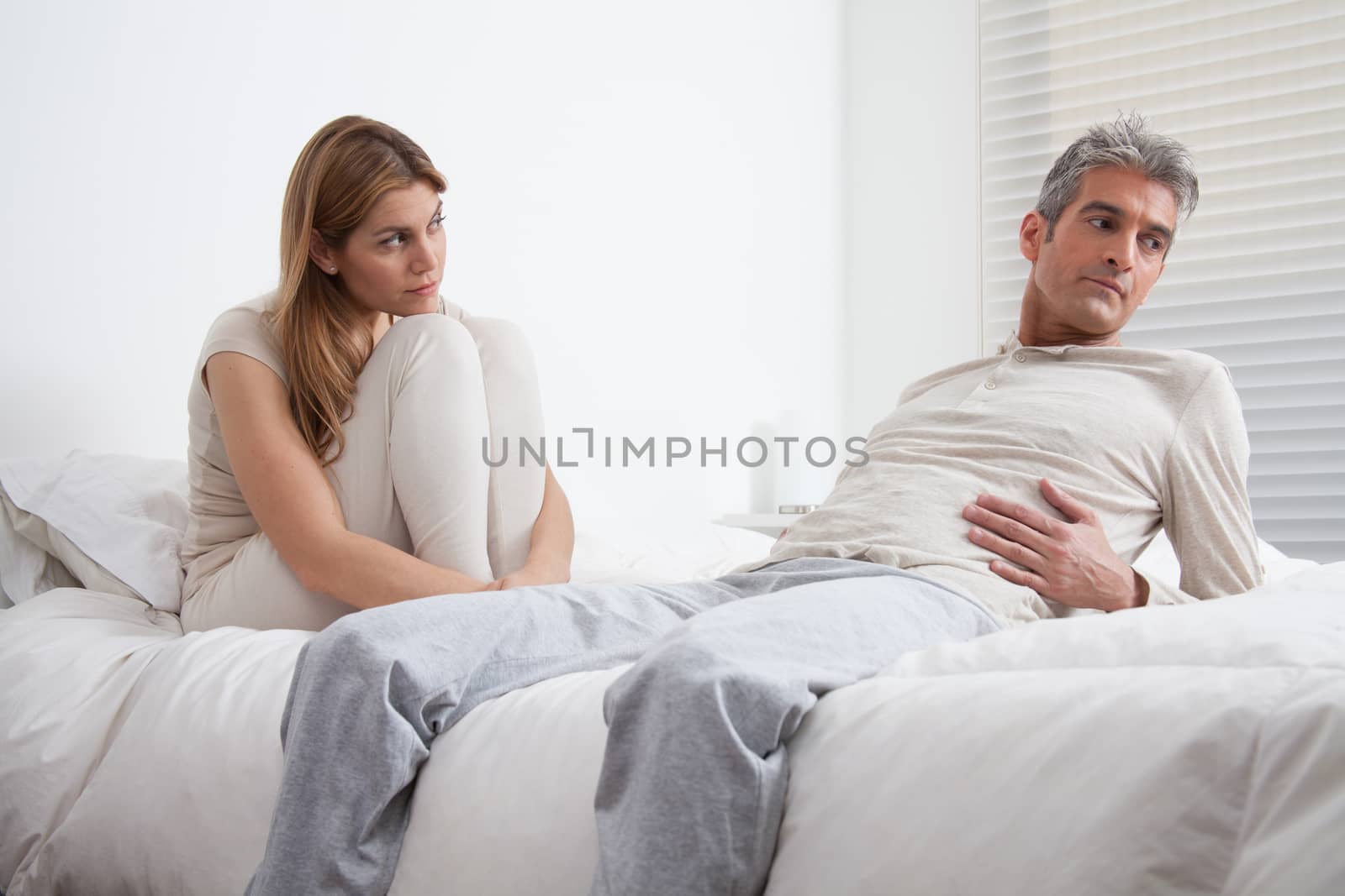 25-30, adult, apartment, attractive, bed, bedroom, caucasian, Couple, depression, fun, handsome, happy, home, horizontal, house, leisure, lifestyle, love, marriage, men, model, nightwear, old, people, person, property, releases, sitting, smile, two, women, years, young